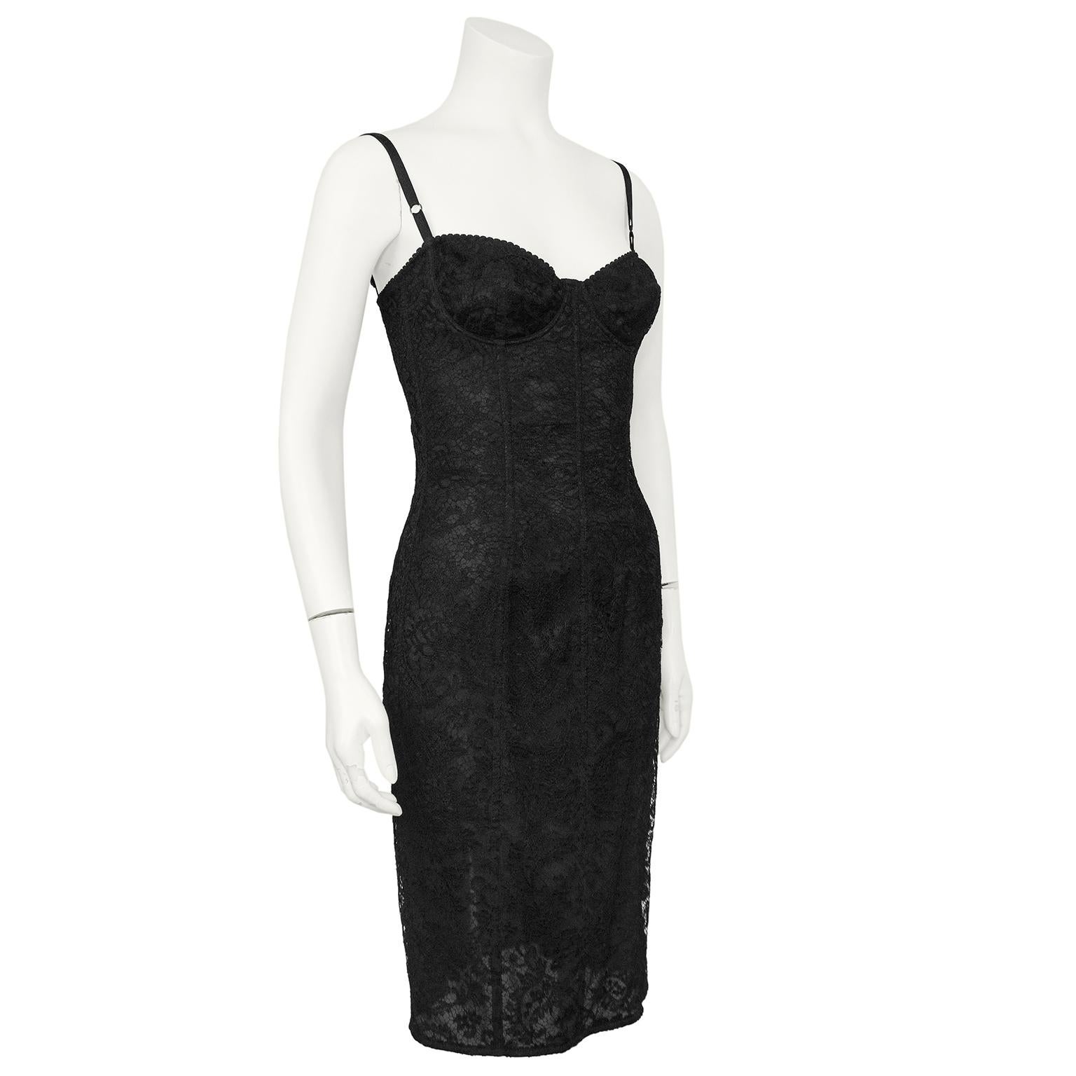 Very sexy and quintessentially Dolce & Gabbana dress from the earl 2000s. Beautiful black lace with a boned bustier bodice. Adjustable spaghetti straps and underwire cups. Length hits just above the knee with a small slit at the centre back seam.