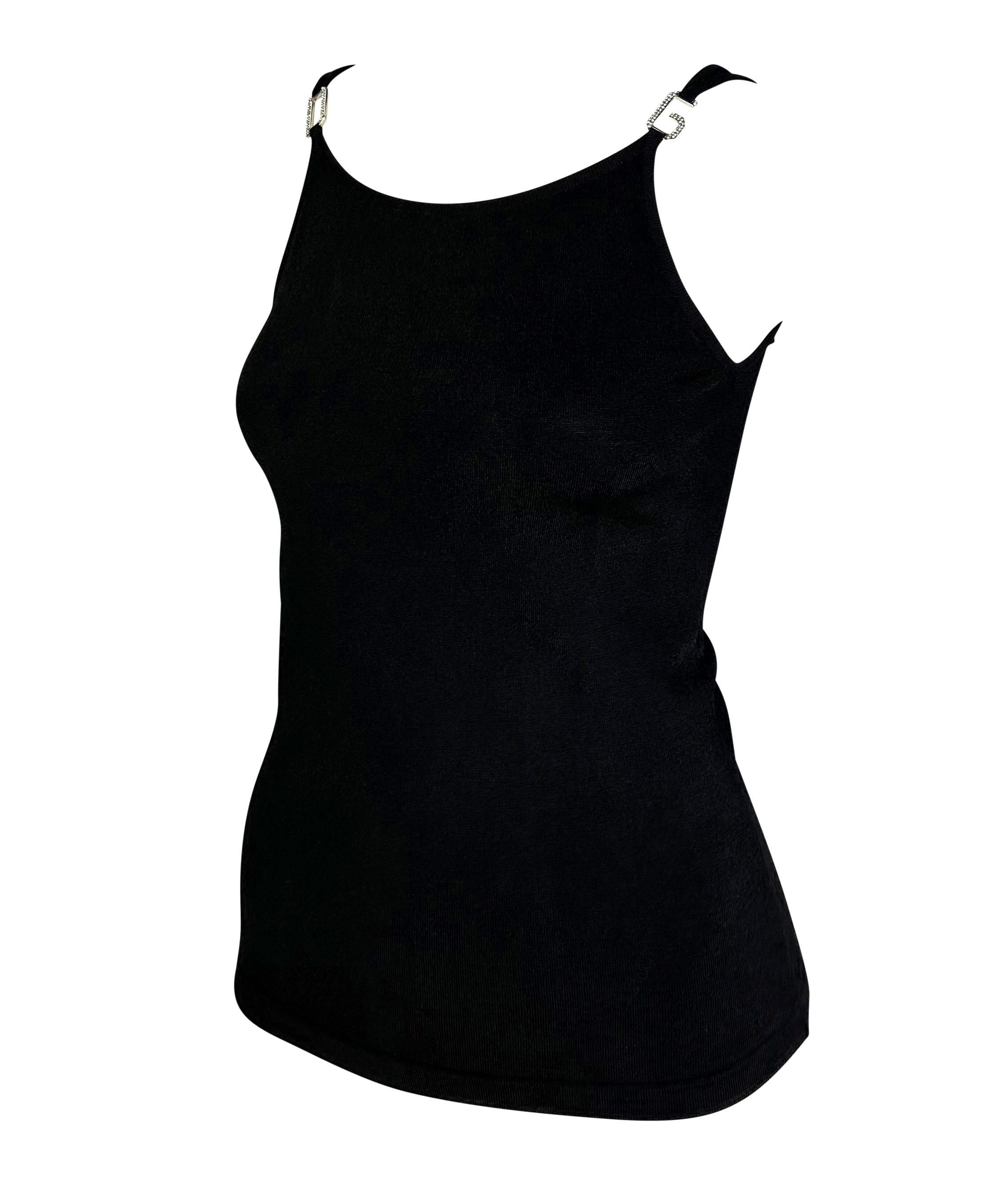Presenting a beautiful black Dolce and Gabbana tank top. From the early 2000s, this top features a wide scoop neckline and back and is made complete with rhinestone accented 'D' and 'G' buckles on either strap. Add this perfectly elevated tank top