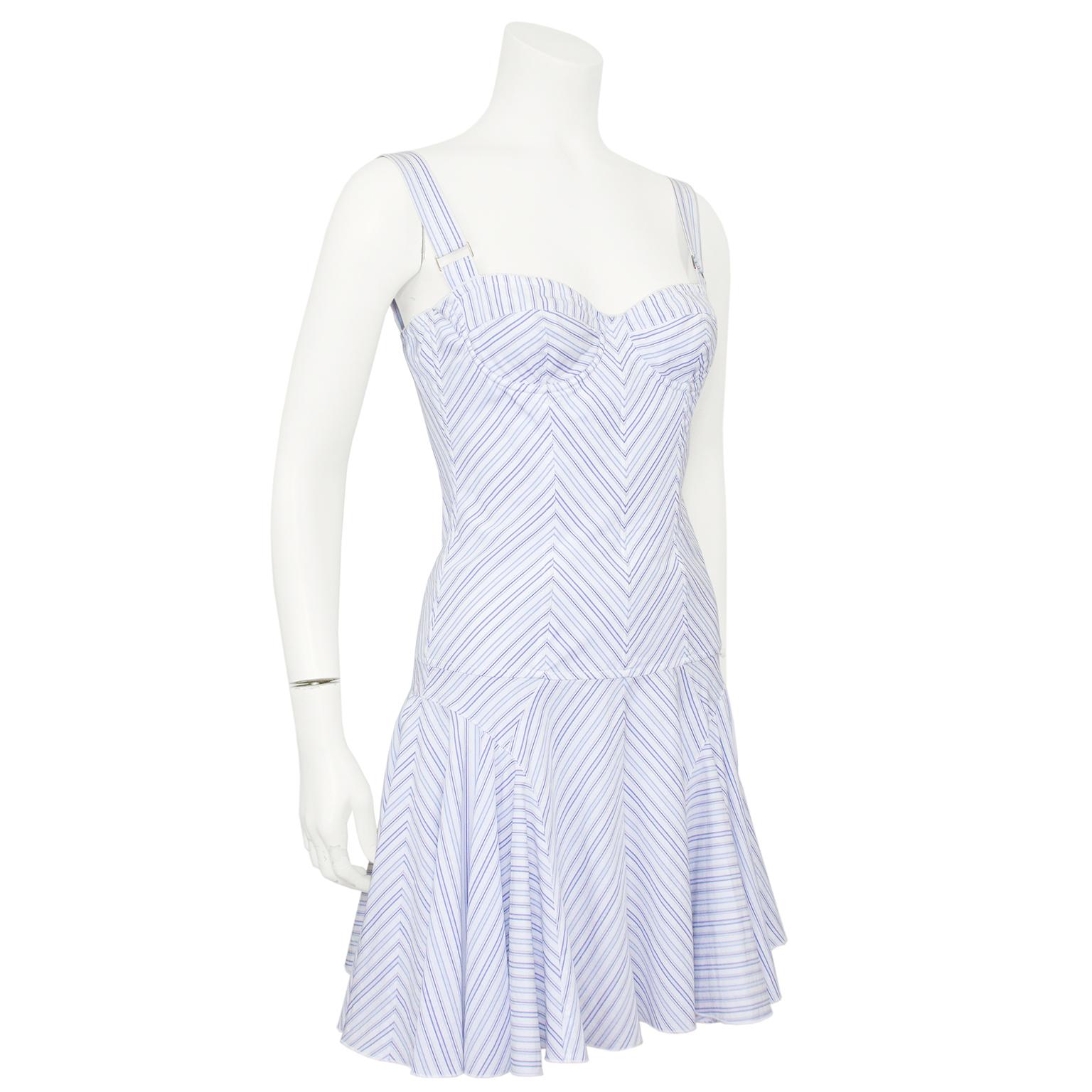 Perfect for summer white and blue chevron striped cotton Dolce and Gabbana dress from the early 2000s. Bustier bodice with wired cups and boning to the hips. Drop waist fit and flare short skirt. 1.5