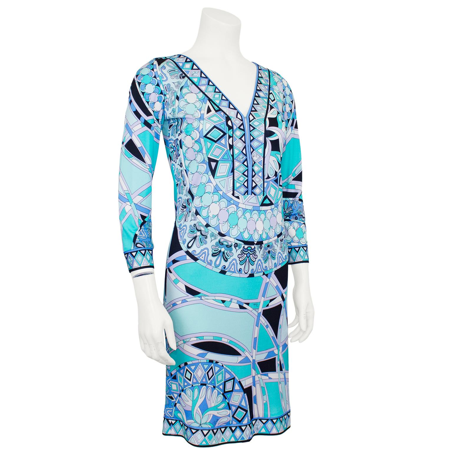 Lovely lycra printed Emilio Pucci dress from the early 2000s. abstract geometric print in shades of blue, periwinkle and turquoise with contrasting white and black. V neckline with hook and eye closures and 3/4 length sleeves. No zipper, must to put