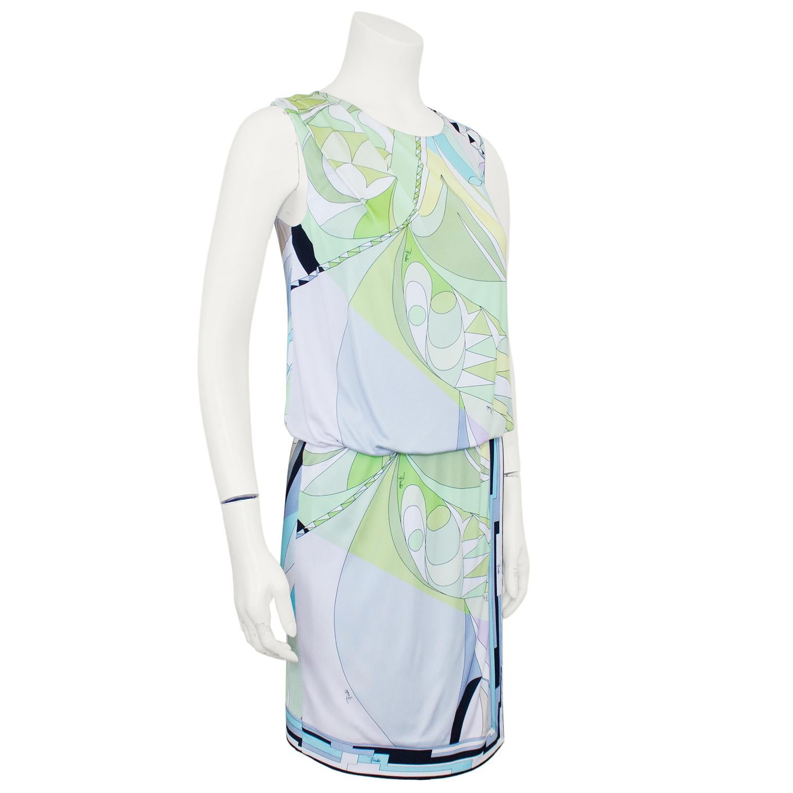 Emilio Pucci sleeveless dress from the early 2000s.Abstract geometric printed jersey with green, blue and purple pastel tones, contrasted with white, black, tan and grey. Loose, draped bodice with a wrap style skirt. Elastic waistband. No zipper,