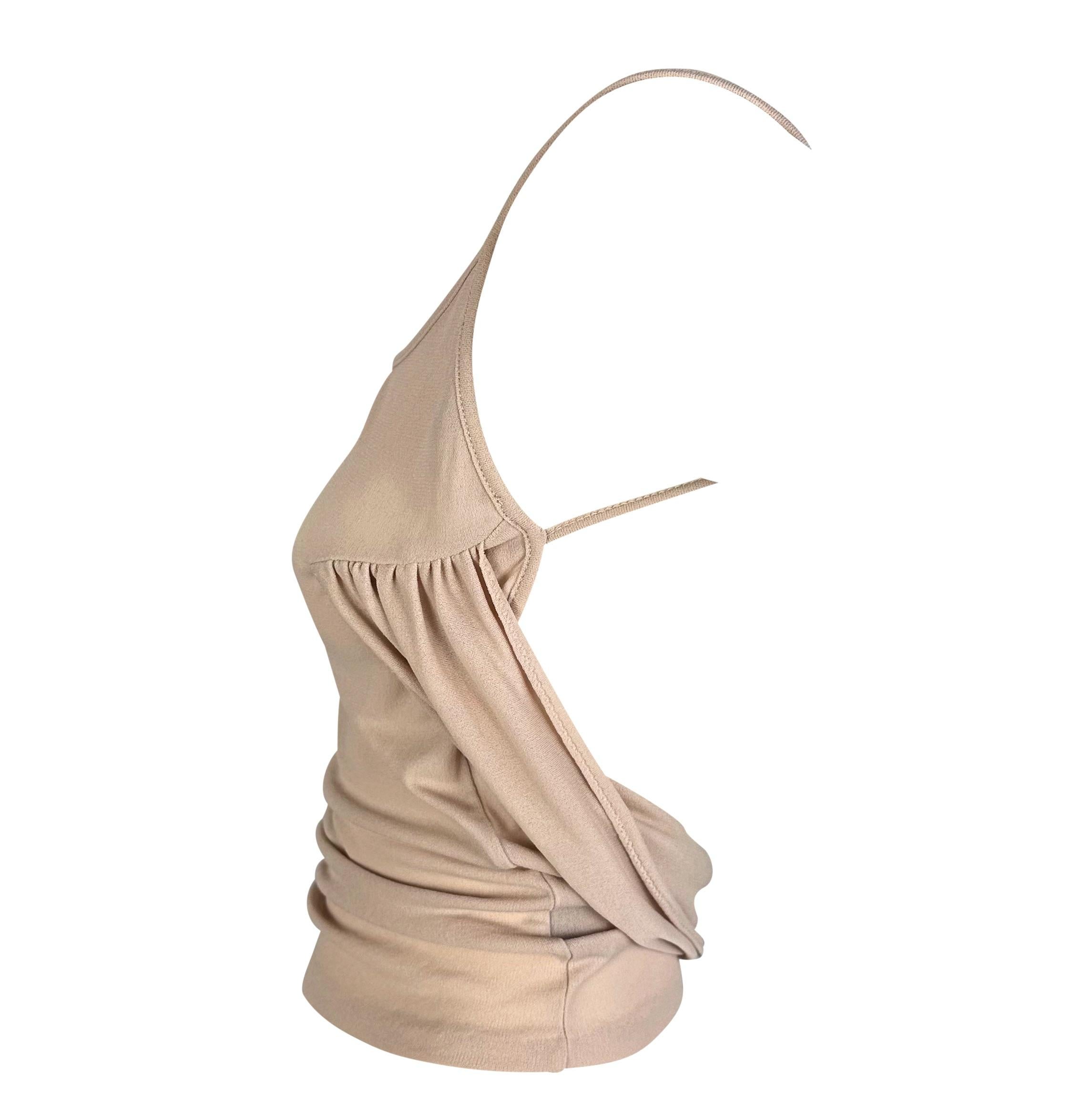 Presenting a fabulous beige Gucci tank top, designed by Tom Ford. From the early 2000s, this incredible ruched top is made complete with an exposed back accented with masterful draping. Add this effortlessly chic and sexy top to your