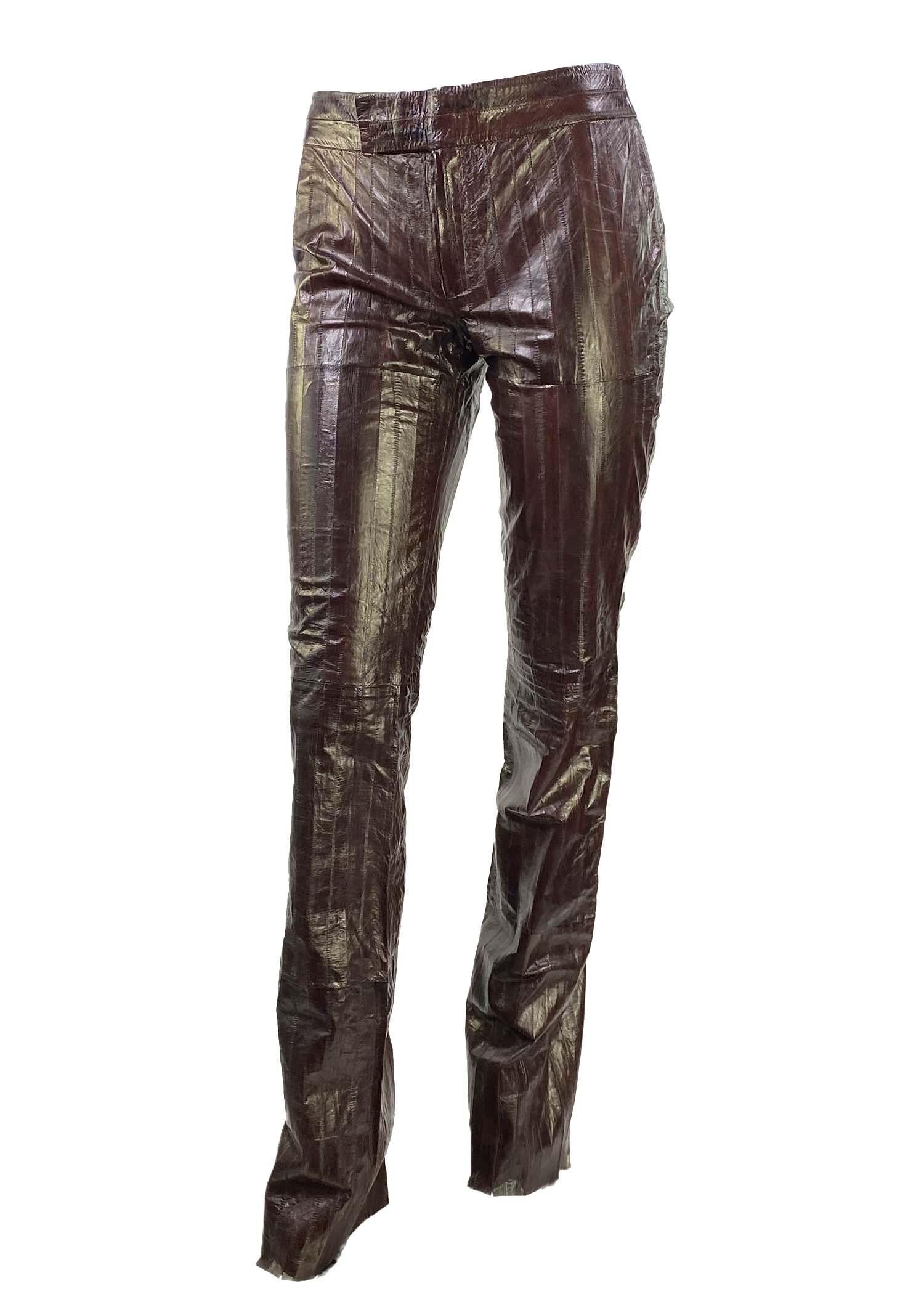 Presenting a fabulous pair of burgundy eel skin Gucci pants, designed by Tom Ford. Constructed entirely of eel hides, these semi-flared pants boast a rich deep red color with natural color variation from the eel skin. A rare find, these pants make a