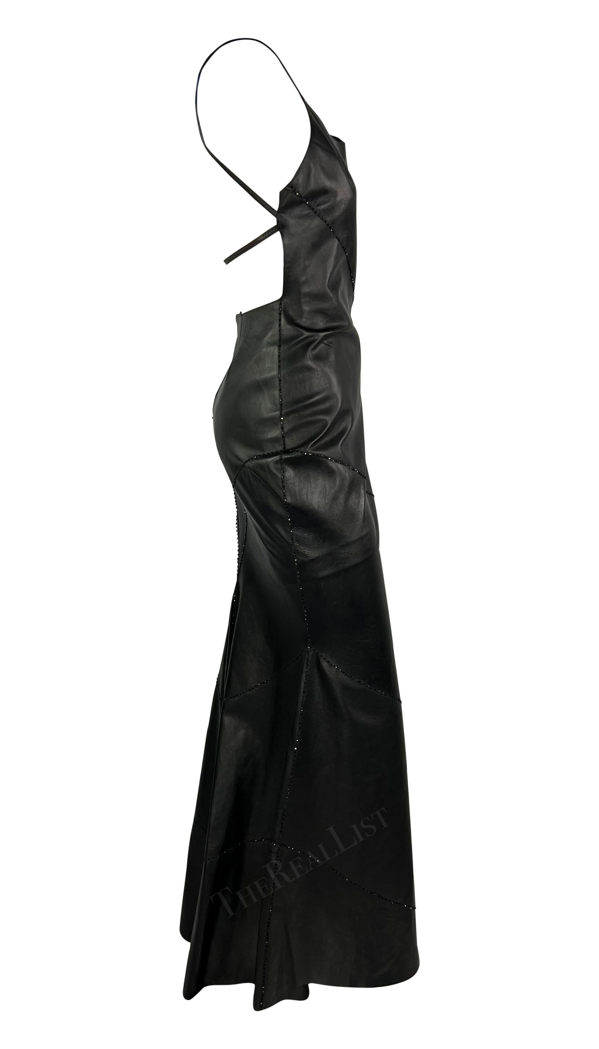 This stunning black leather gown by Pamela Dennis Couture dates back to the early 2000s. Crafted entirely from black leather, it boasts intricate asymmetric lines of black seed beads across its floor-length silhouette. The dress features a high