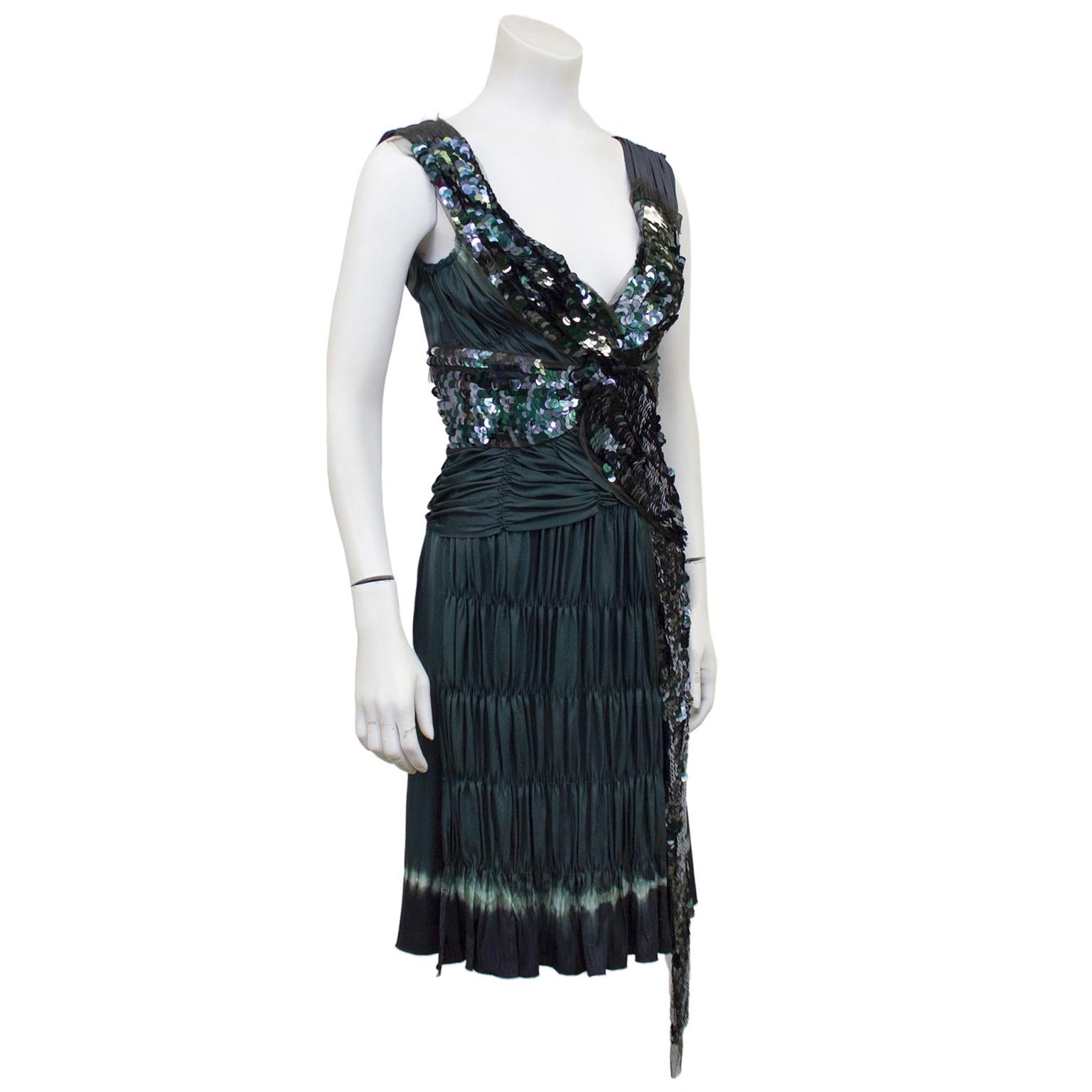 Stunning early 2000's Prada olive/grey cocktail dress. The dress is v neck with a fitted bodice featuring large teal sequins throughout, with ruching and netting details. Straps are a dark grey/silver and ruched at the shoulder seam. Dress is drop