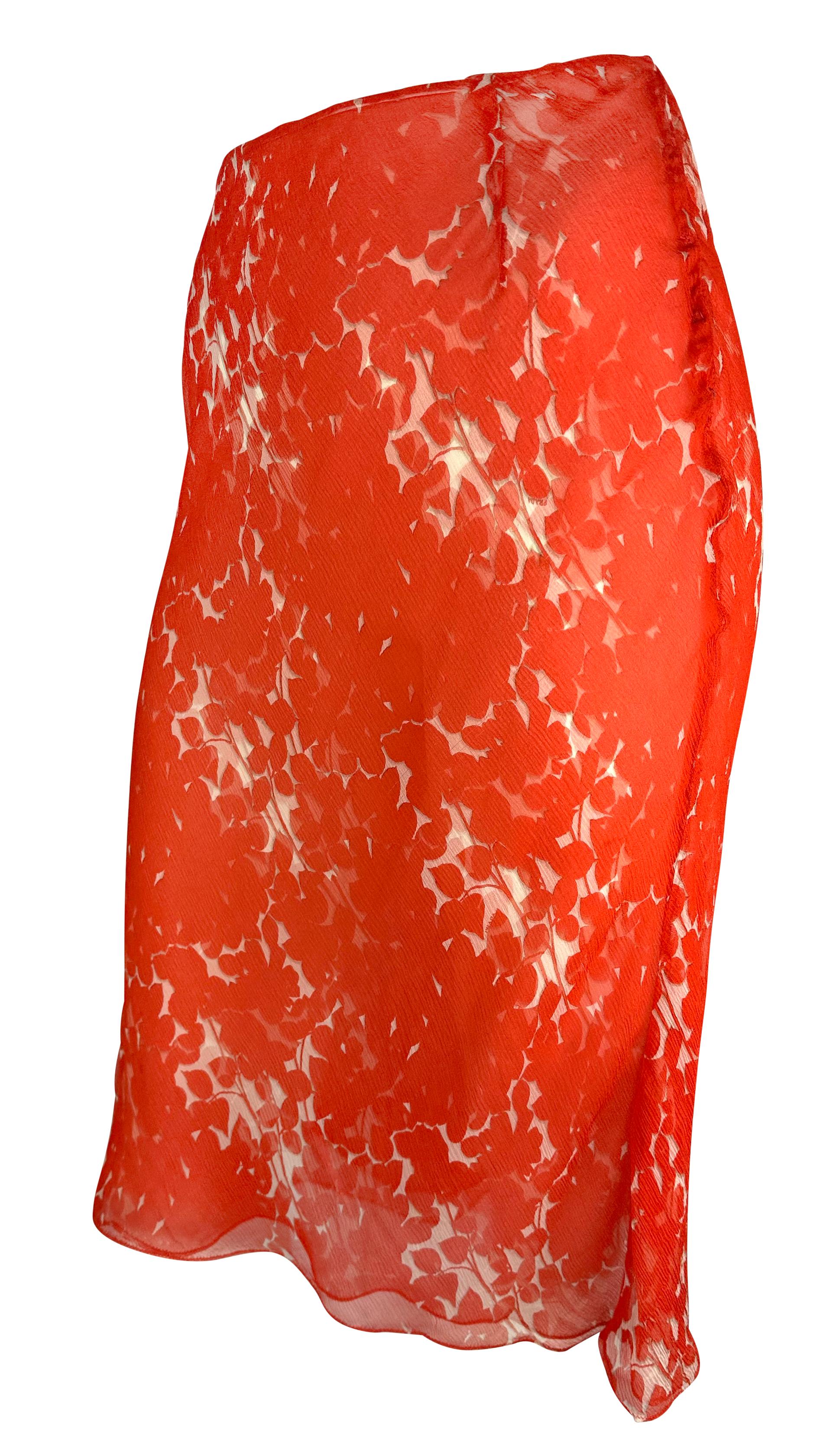 From the early 2000s, this red Prada midi skirt features an abstract floral print on delicate chiffon. Cut just below the knee, the airy design reflects the understated sensuality of Muiccia Prada’s early 2000s aesthetic.

Approximate