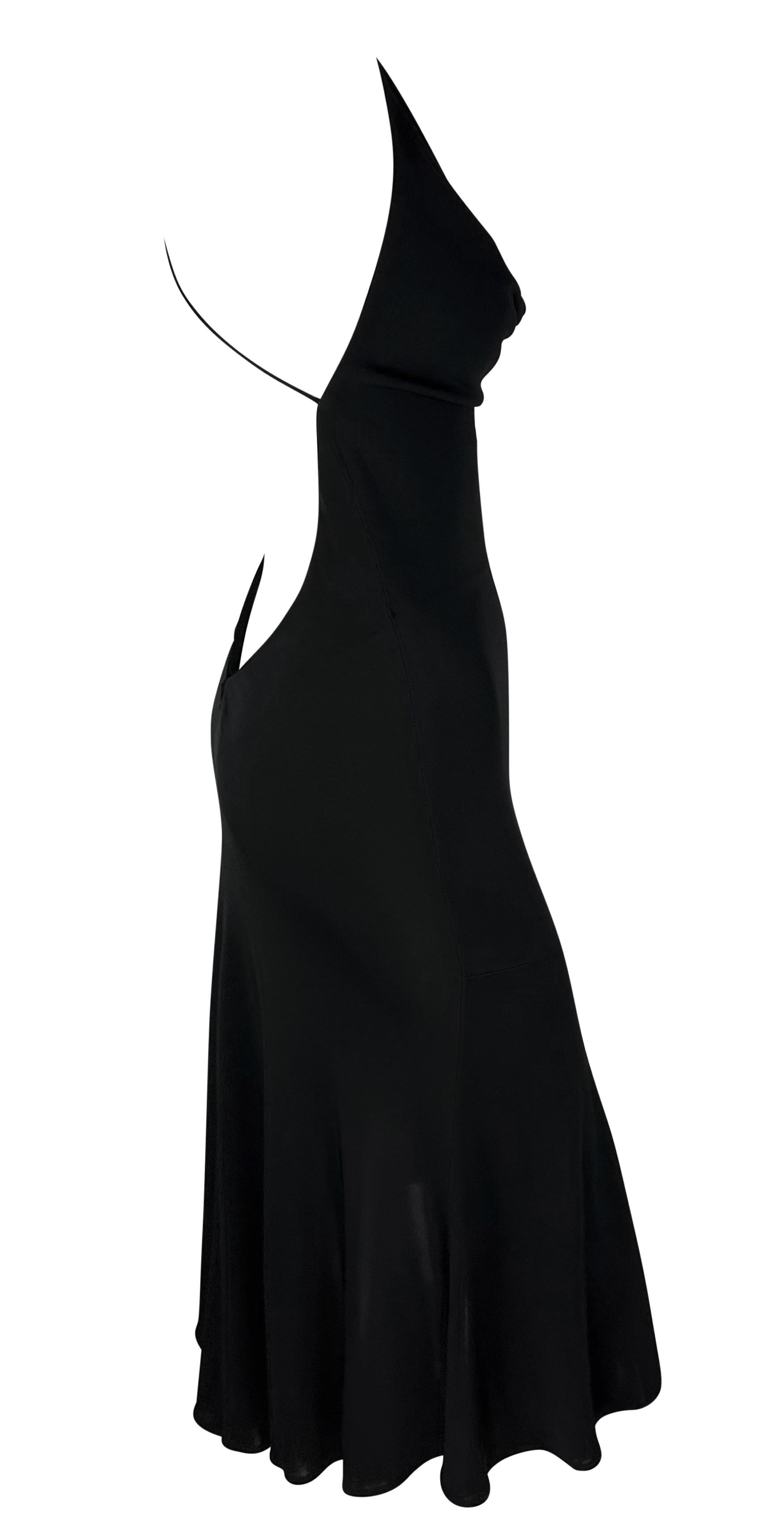 From the early 2000s, this black sheer Yigal Azrouël slip dress is the perfect little black dress. This girly flare dress features a low cowl neckline, spaghetti straps, and an exposed back. 

Approximate measurements:
Size - removed
Bust: 30