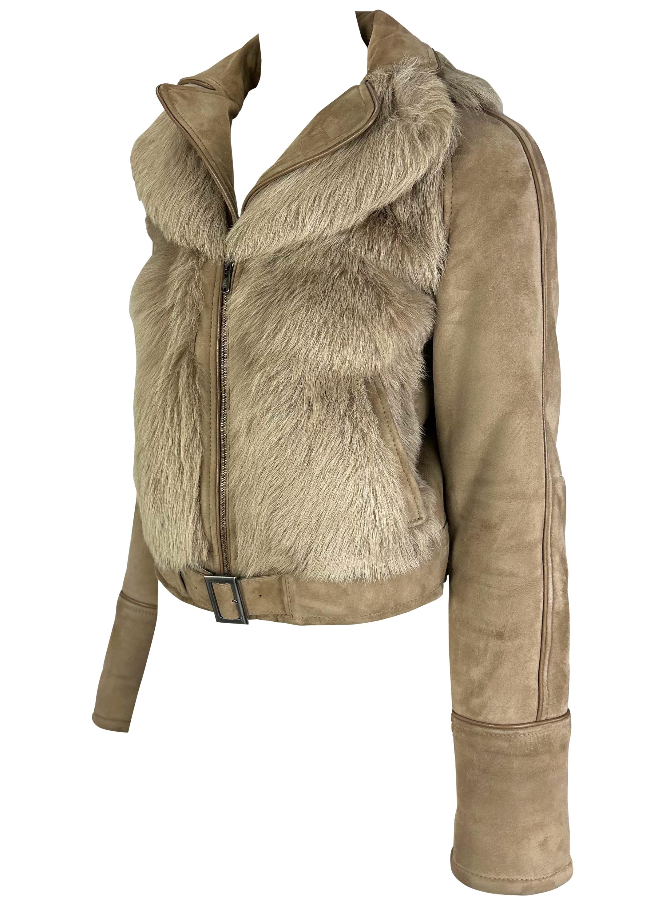 Presenting a fabulous beige goat fur suede Yves Saint Laurent moto coat. From the early 2000s, this incredible coat is constructed entirely of monotone fur and supple suede with a zipper closure, belt, and layered collar. This incredible coat is