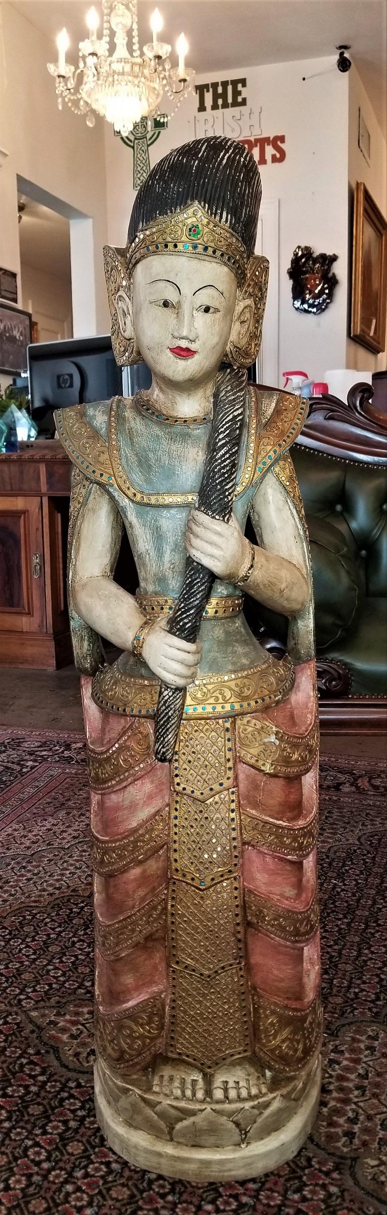 Presenting a gorgeous early 20th century Thai goddess polychrome statue.
Made in Thailand in the early 20th century, circa 1920.
Hand carved wooden statue which has been hand painted (polychromed) all-over. The headdress is gilded, as are parts of