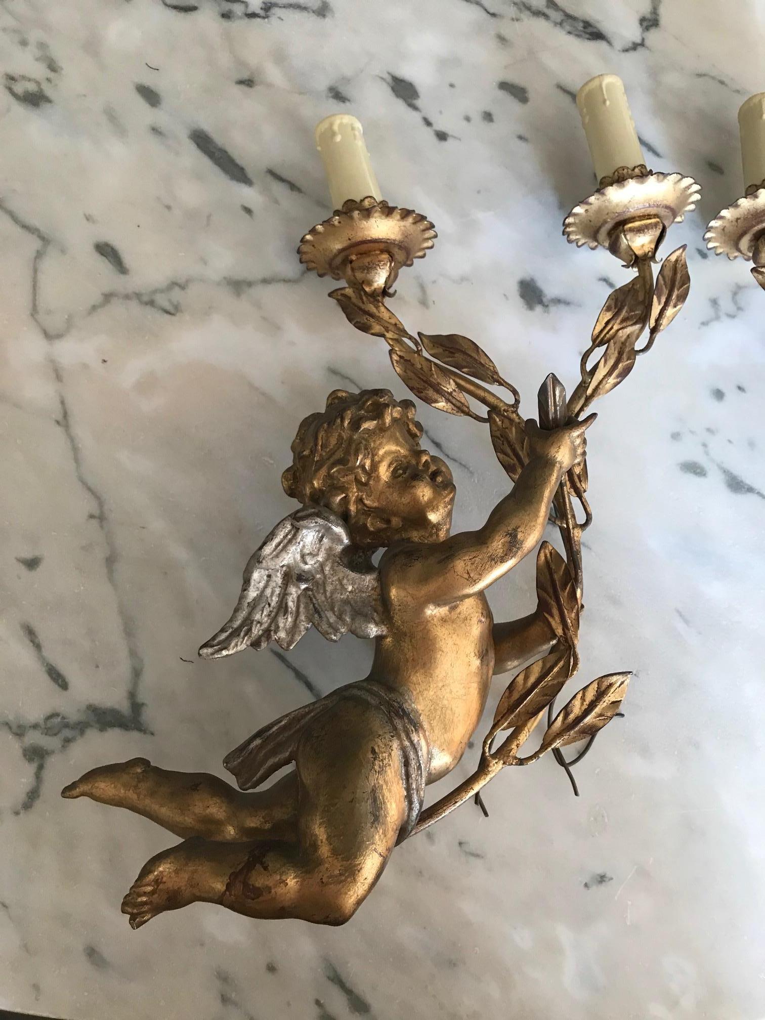Beautiful early 20th century French golden wood pair of angel sconces.
Very high quality.
Electrified with two lights.
Metal bracket.