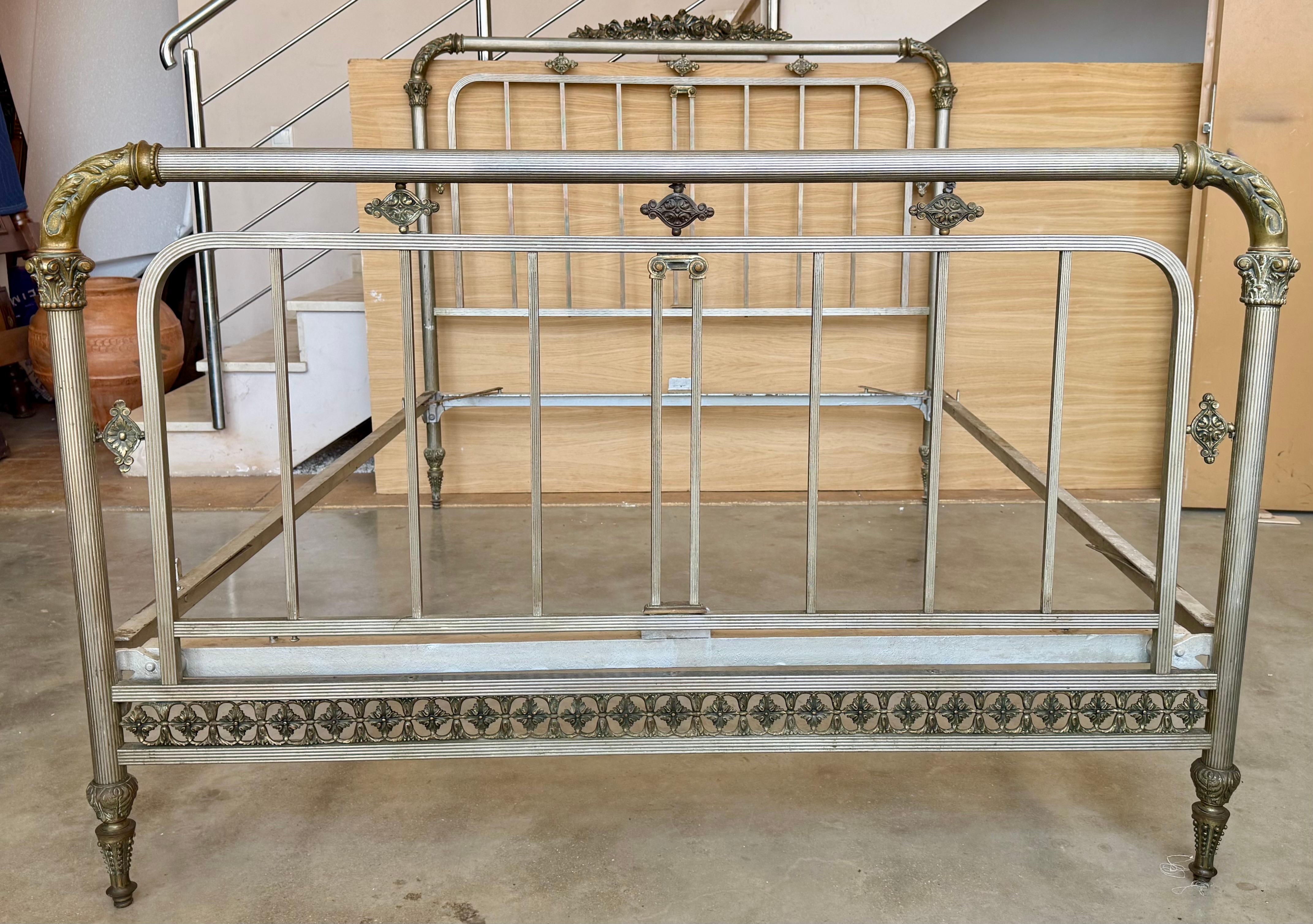 Stylish and unusual French antique brass bed. Rectangular in form but with smooth rounded corners, tubular rails and ball finials. A good quality well-made bed. In good condition, sturdy and strong with good colour and nice patina, clean but not