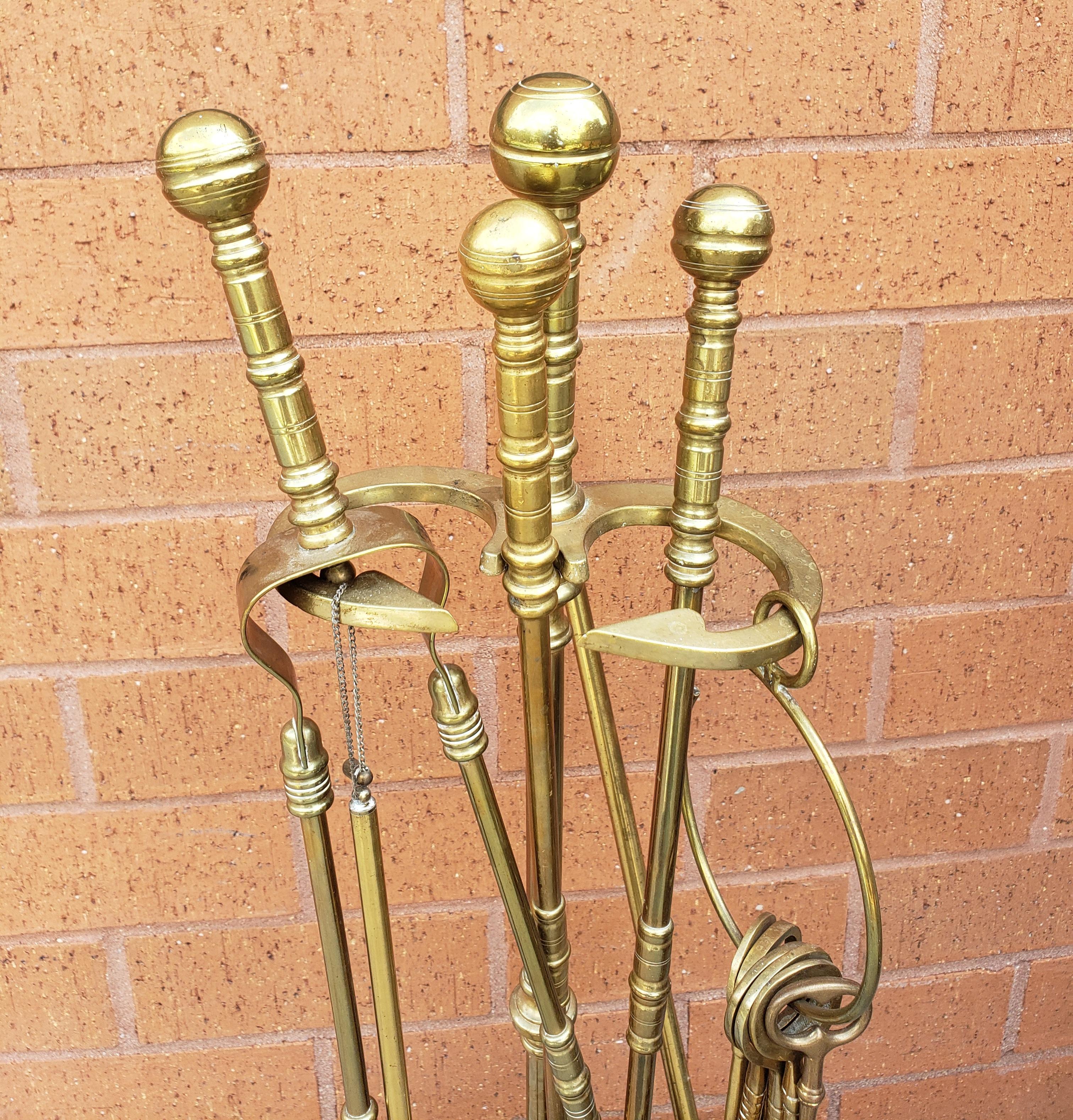 An Early 20th Century Gorgeous 7 piece George III style Canon Ball pure cast brass fireplace tool set in great vintage condition with a bonus antique  large skeleton key set of 5 Assorted Antique Polished Solid Brass Skeleton Keys on Large Jailers