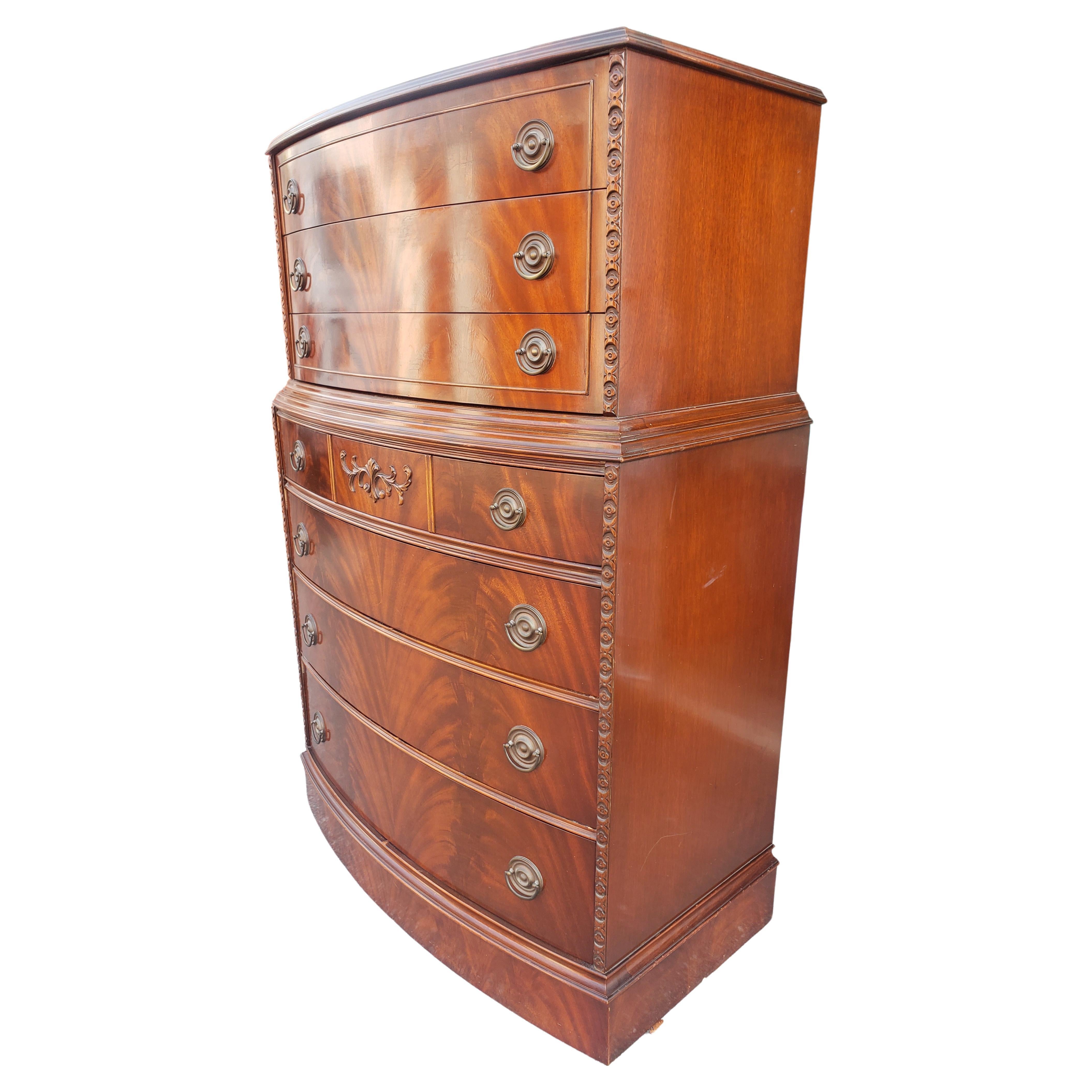 A gorgeous, rare Early 20th Century American Empire Bow Front Flame Mahogany chest on chest of drawers with Beatiful craving decorations and dovetail construction drawers working close to perfection.
Measure 40 in width, 21