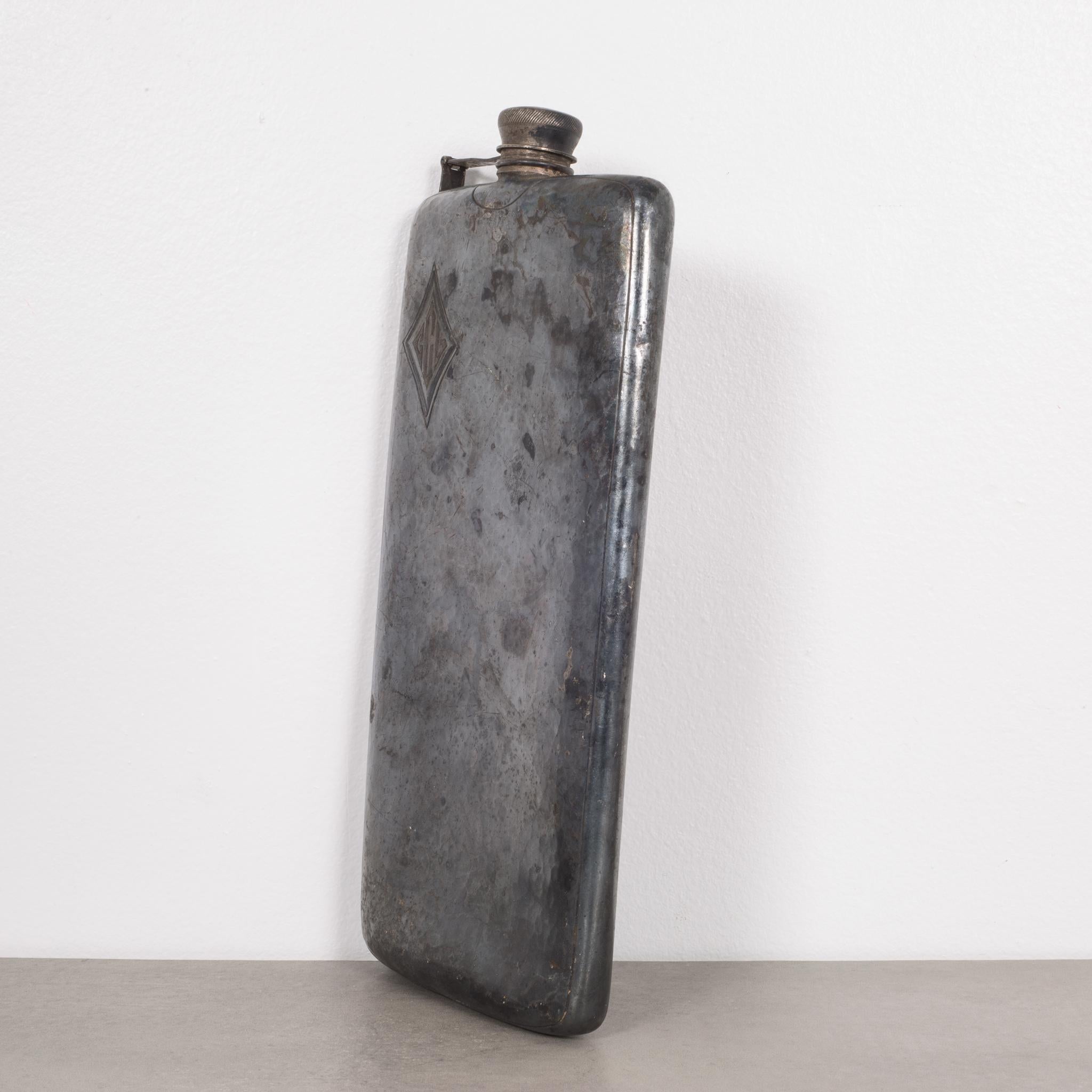 About

This is an original oversized pewter flask monogrammed 