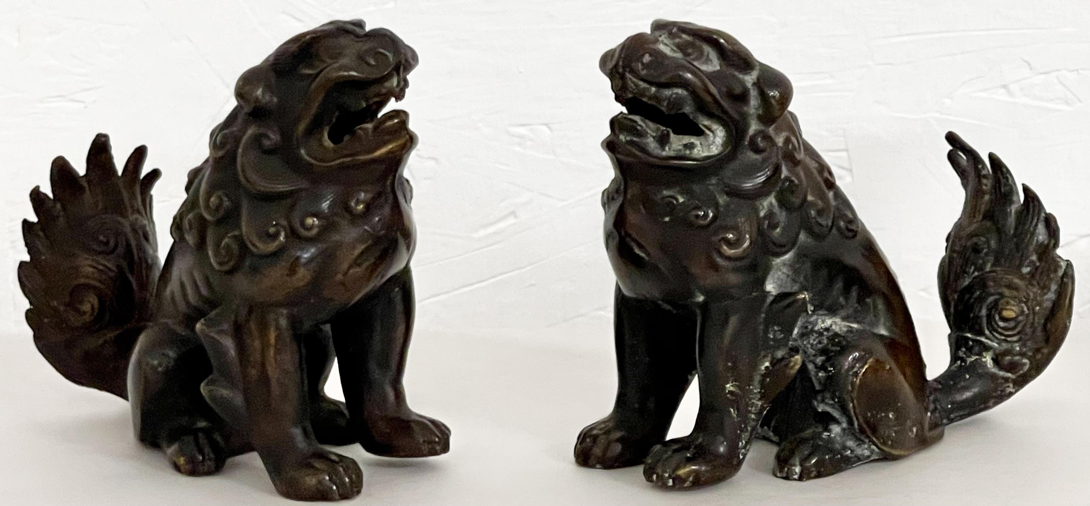 These are a pair of early 20th century Chinese bronze foo dogs. They are a heavy casting and in very good condition.
