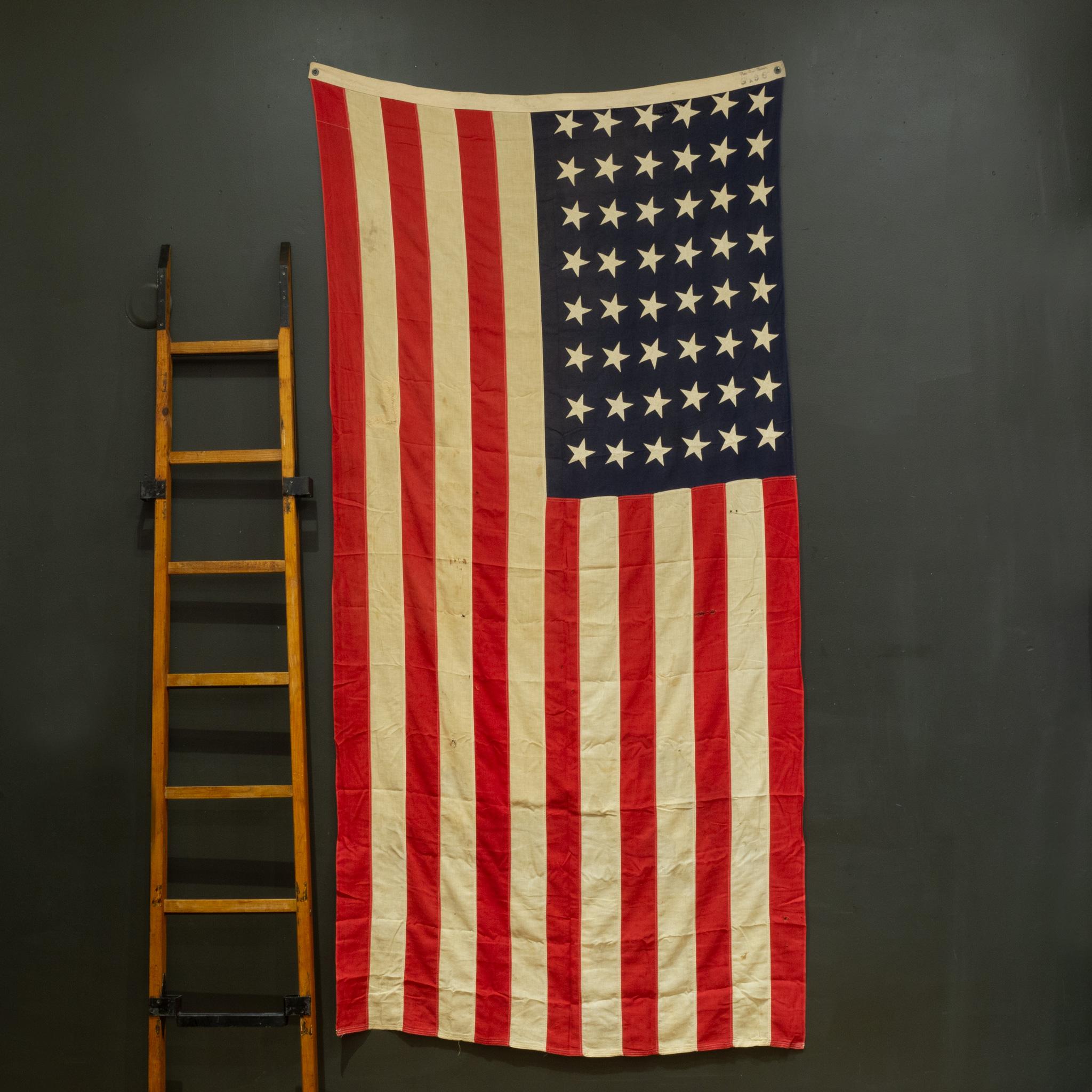 ABOUT

An original monumental American flag with 48 hand sewn stars and metal grommets to hang it.

    CREATOR Best Ross Bunting.
    DATE OF MANUFACTURE c.1940-1950.
    MATERIALS AND TECHNIQUES Cotton, Metal.
    CONDITION Good. Wear consistent