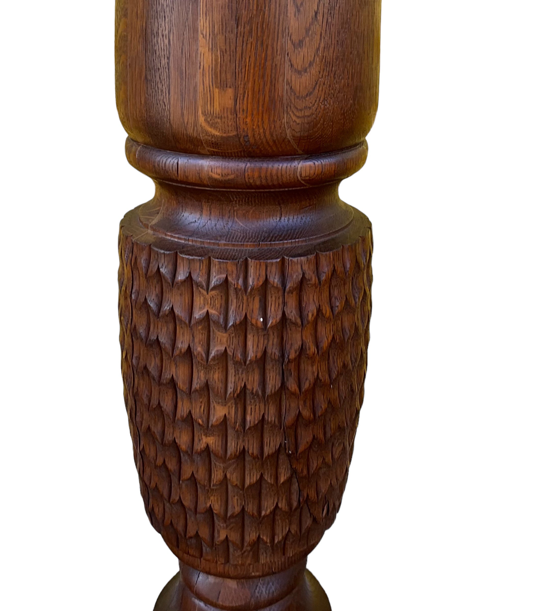 This is an early 20th century British colonial style carved oak pineapple form pedestals. They are in very good condition and are a great size to support your statuary or plants!