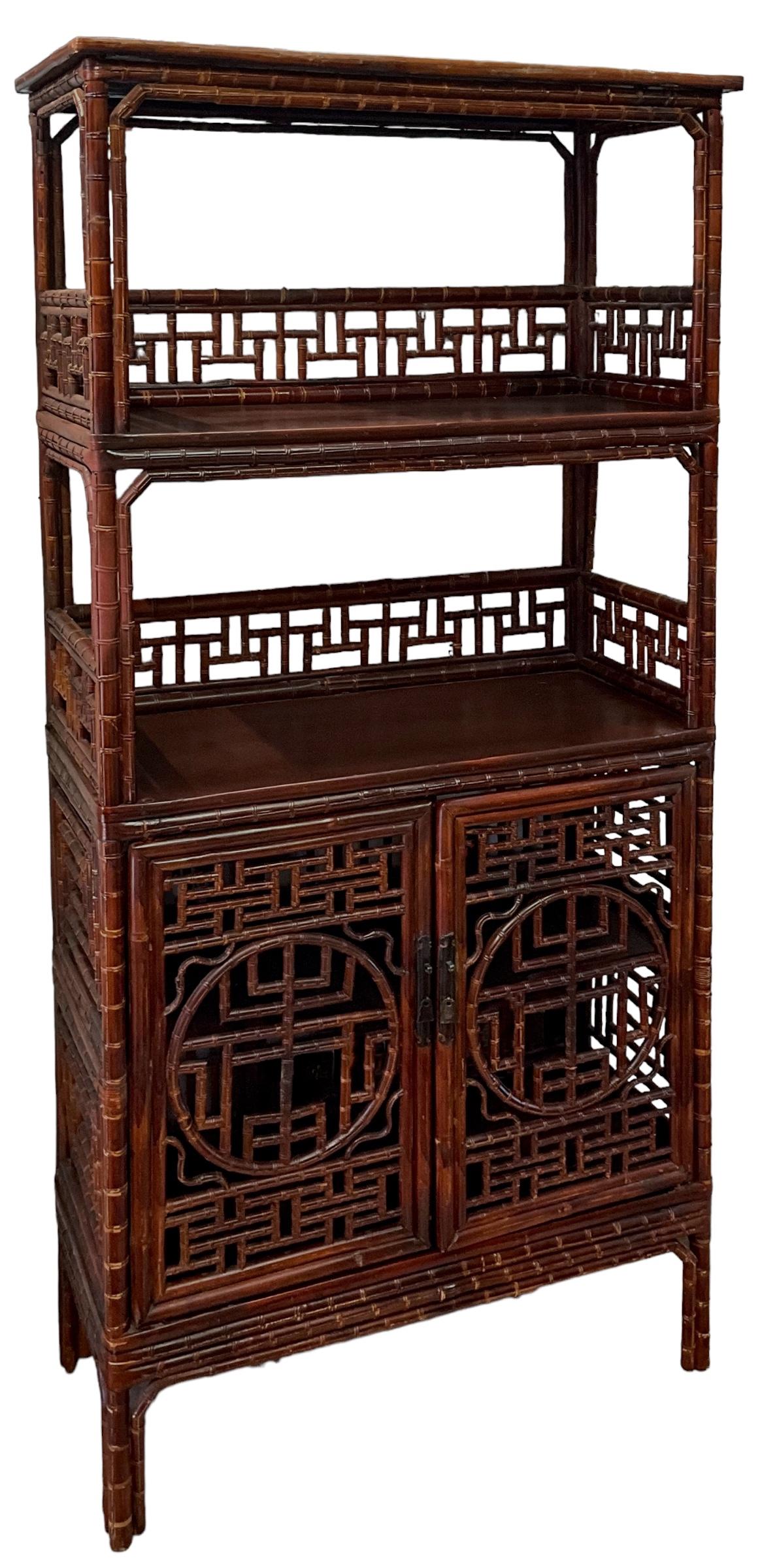This is such a versatile piece! It is an antique Chinese bamboo cabinet with ornate fretwork and original hardware. I love that the bottom portion opens to storage. The shelves are sturdy, and the frame is as well. It is unmarked. 

My shipping is