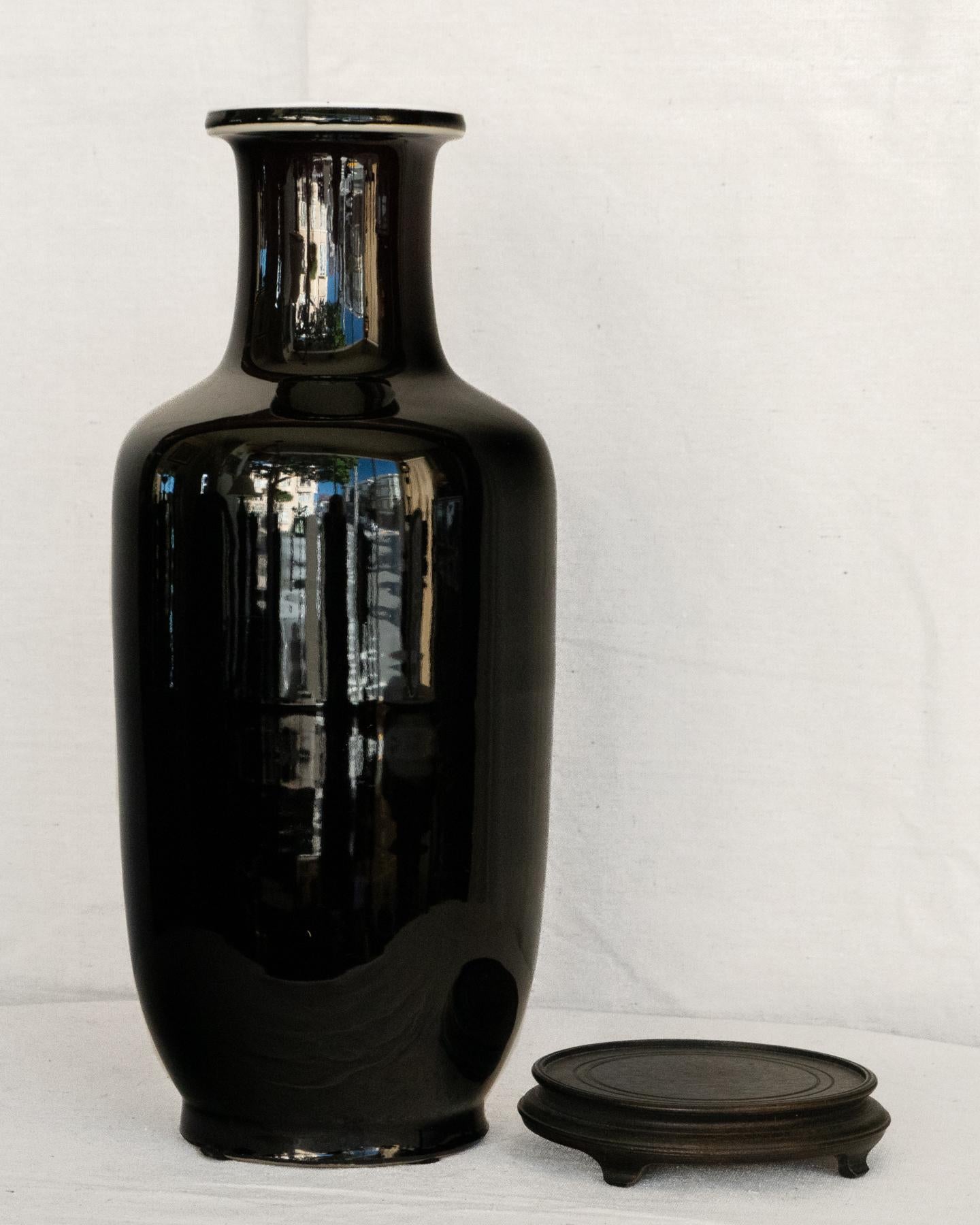 Early 20th century Chinese mirror black vase in the Kang Hsi style. 
Republic Period with an earlier reign mark. With hardwood stand. This is two items, a vase and hardwood stand.