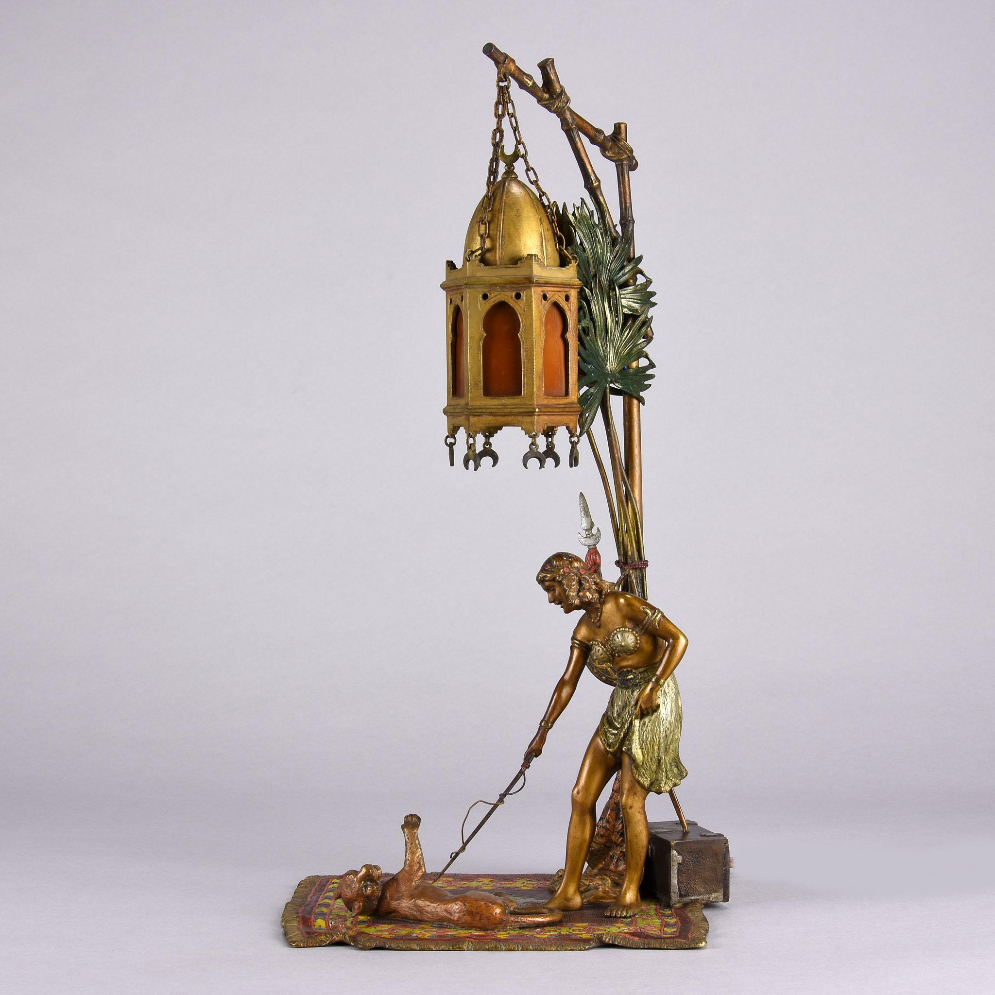 An excellent early 20th century Austrian bronze of a young Harem beauty training her puma underneath a palm tree lamp with fabulous detail and very fine colour. Signed with the Bergman ‘B’ in an amphora vase and rewired.
Additional