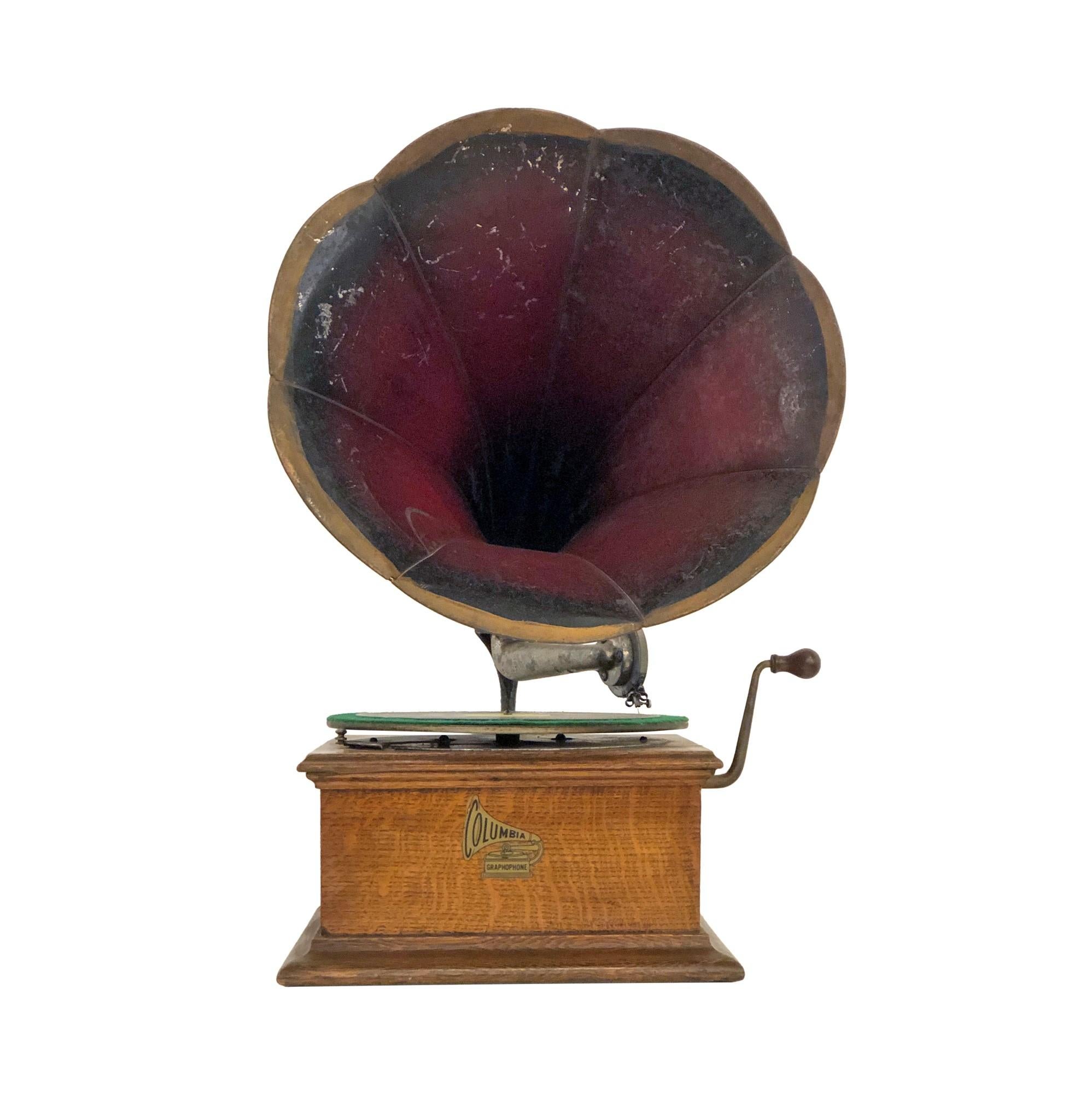 Early 29th Century Graphophone manufactured by Columbia. Comes with the original horn. Five early 78 records are included. Overall in good condition with one crack and some wear on the horn. This can be seen at our 333 West 52nd St location in the