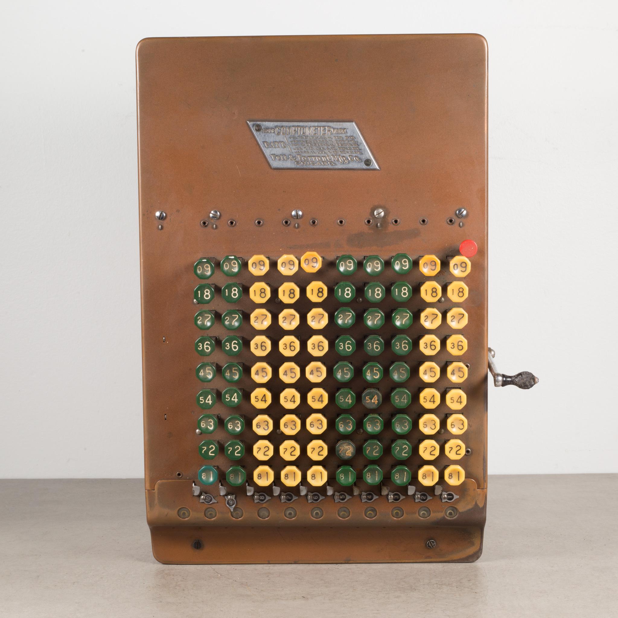 About
An antique Comptometer copper and tin adding machine with yellow and green Bakelite buttons. The lever pulls forward and back working the inner mechanisms. The piece has retained its original finish and is in good condition with appropriate