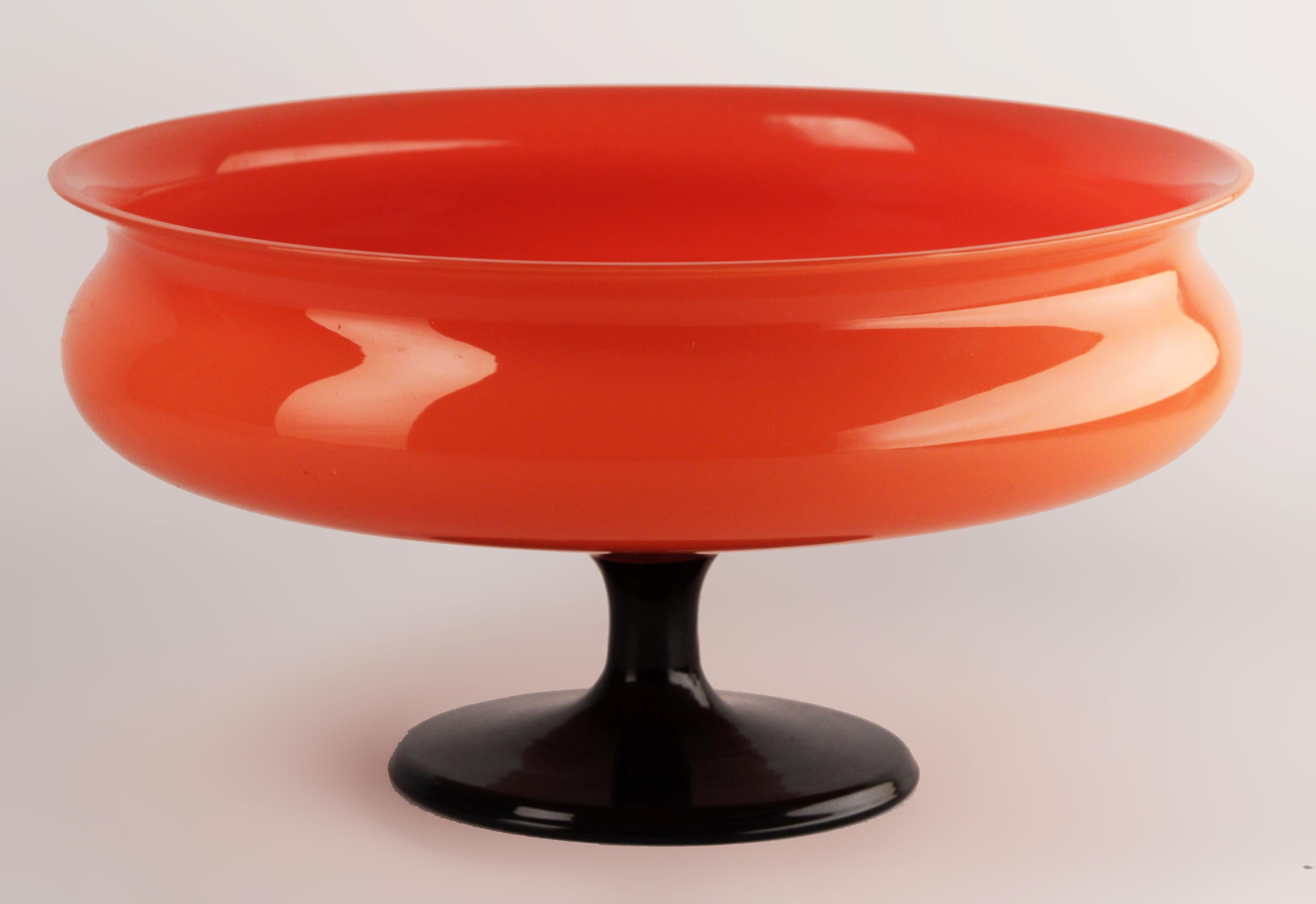 Early 20th century czech cased glazed art glass tango Powolny-like red bowl with foot

By: Michael Powolny (in the style of)
Material: glass, art glass
Technique: cast, polished, glazed, molded
Dimensions: 10 in x 5 in
Date: early 20th