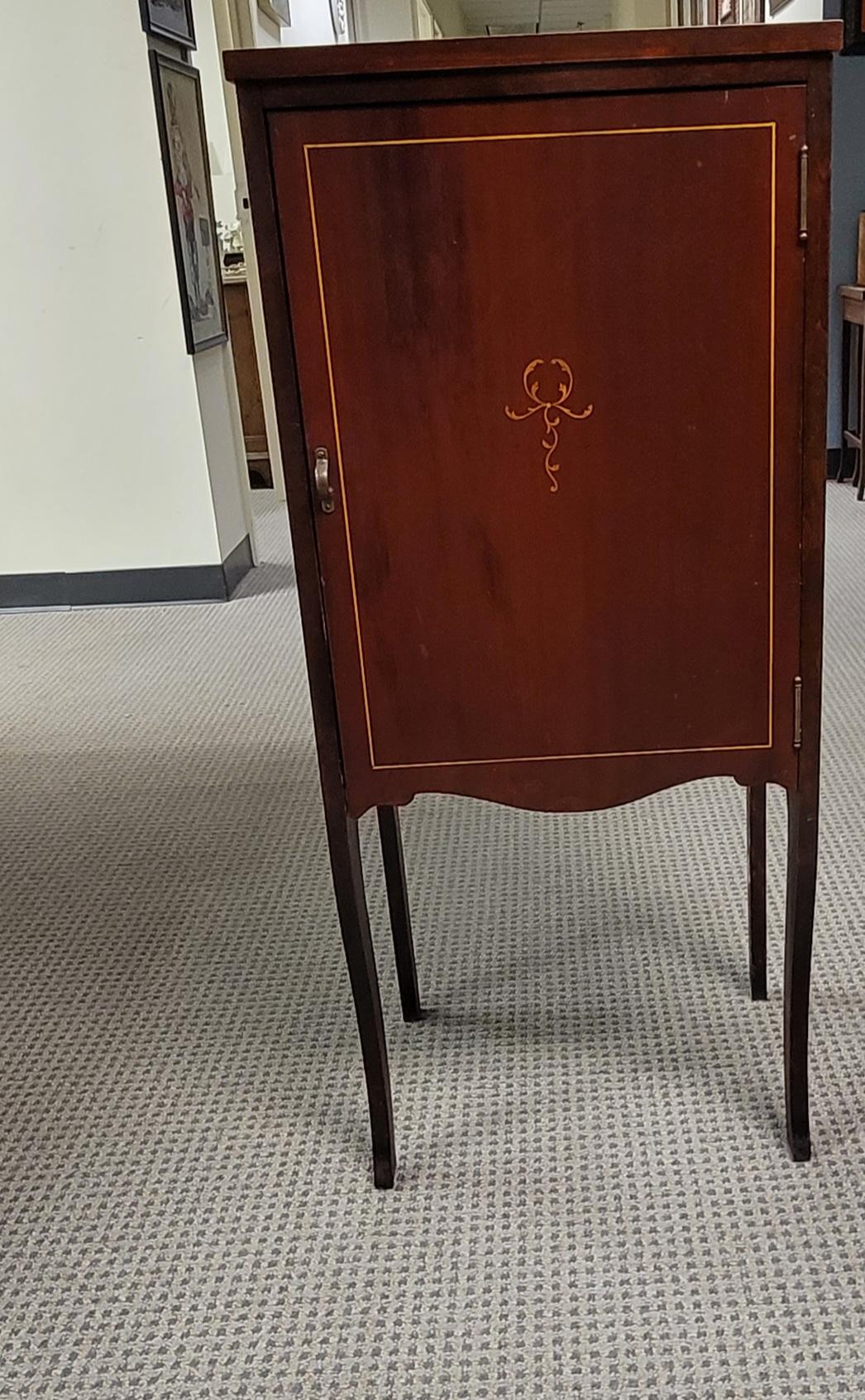 An Early 20th C. Edwardian Mahogany Marquetry Satinwood Inlaid Sheet Music Cabinet with fine inlays. 
Features 4 equal shelves compartments with a 5