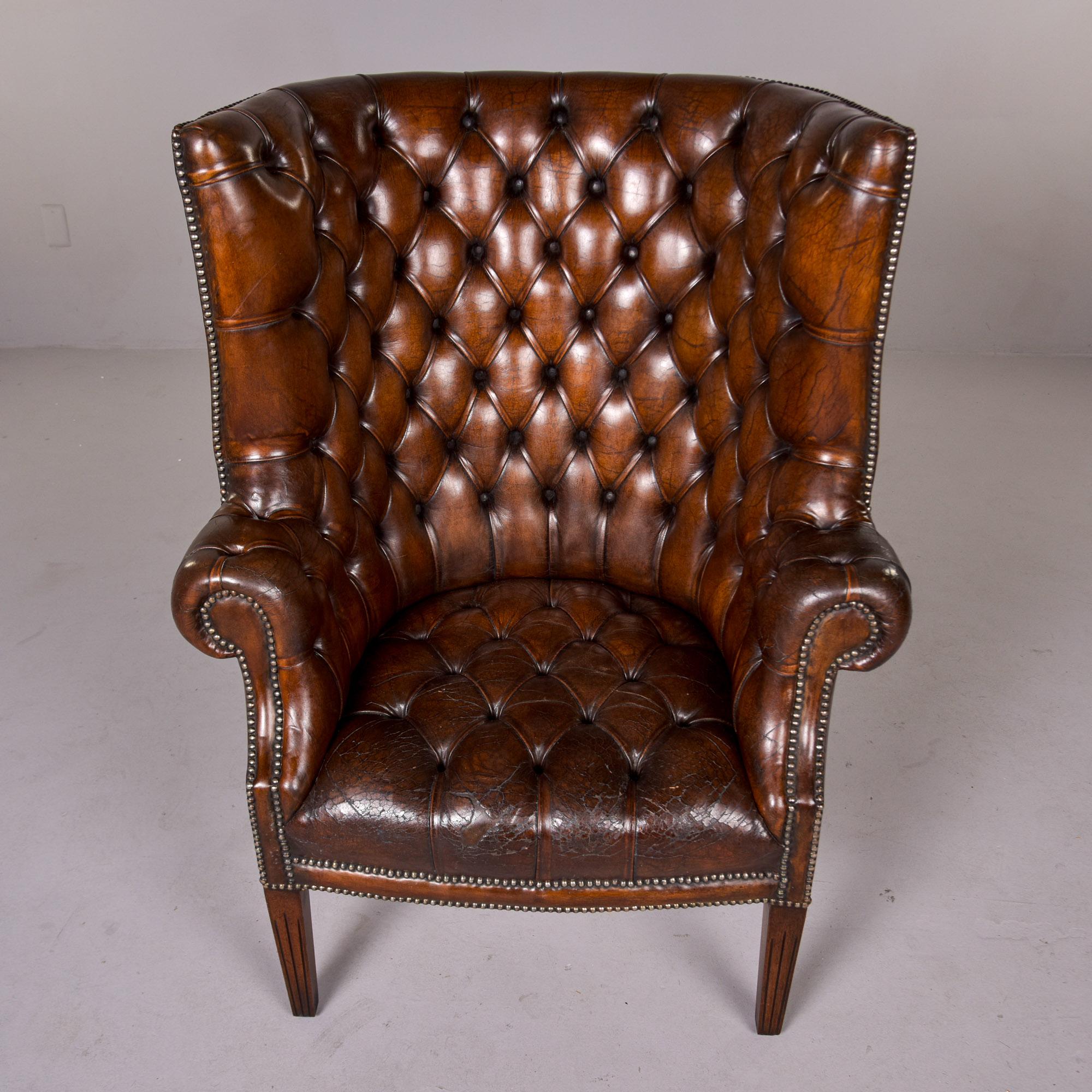 Chippendale Early 20th C English Button Tufted Leather Wing Back Library Chair For Sale