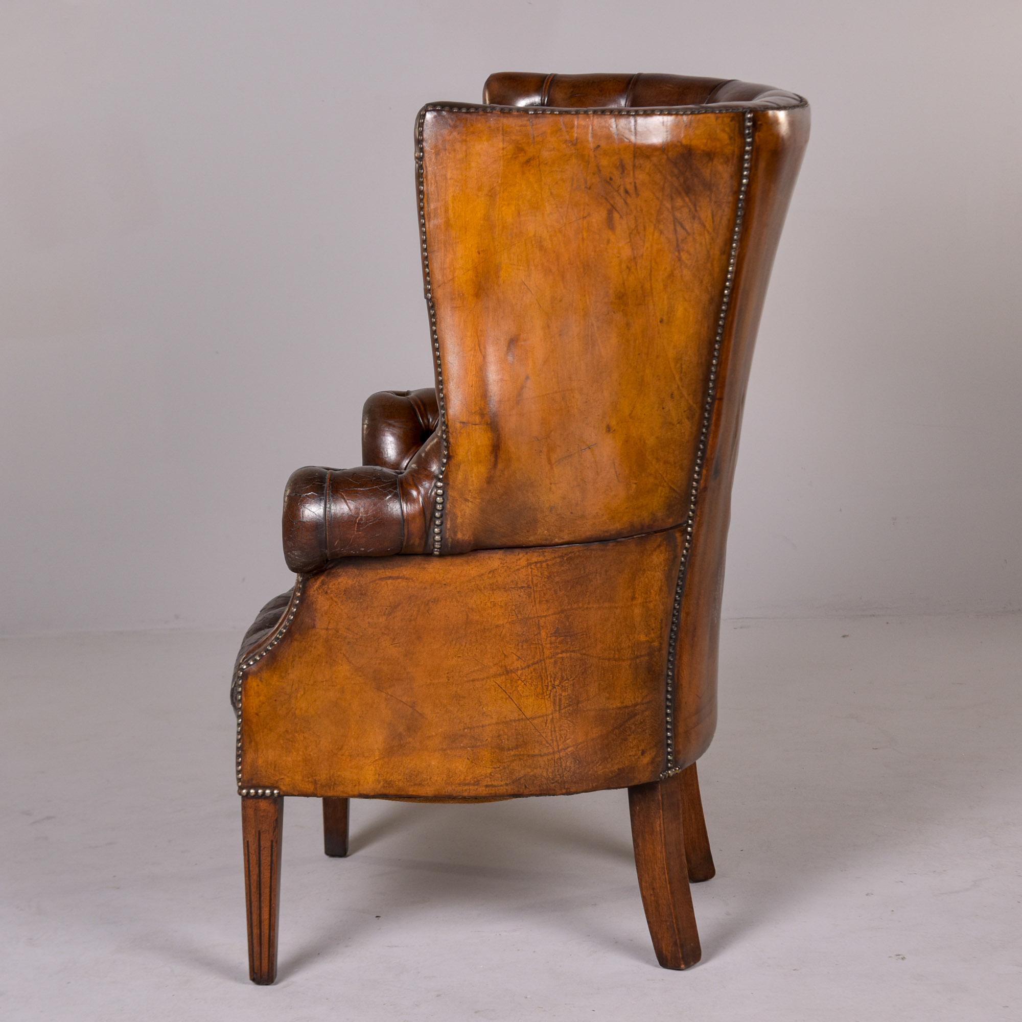 20th Century Early 20th C English Button Tufted Leather Wing Back Library Chair For Sale