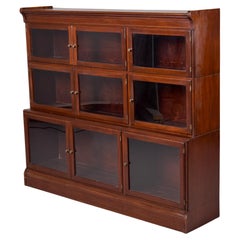 Librería apilable inglesa de caoba con frente de cristal de principios del siglo XX