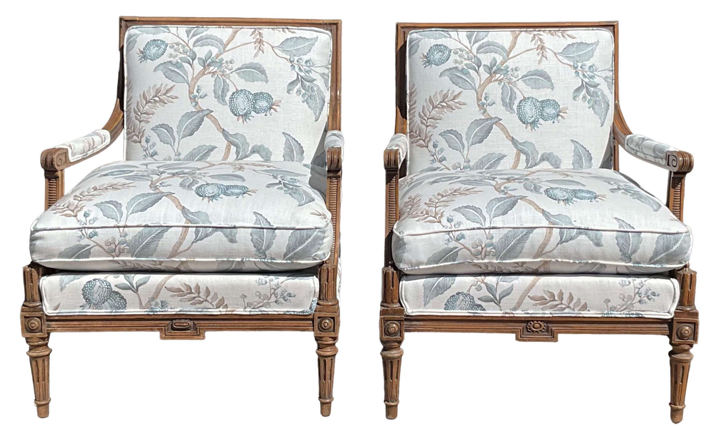 20th Century Early 20th-C. French Carved Walnut Bergere Chairs In New Floral Linen -Pair For Sale