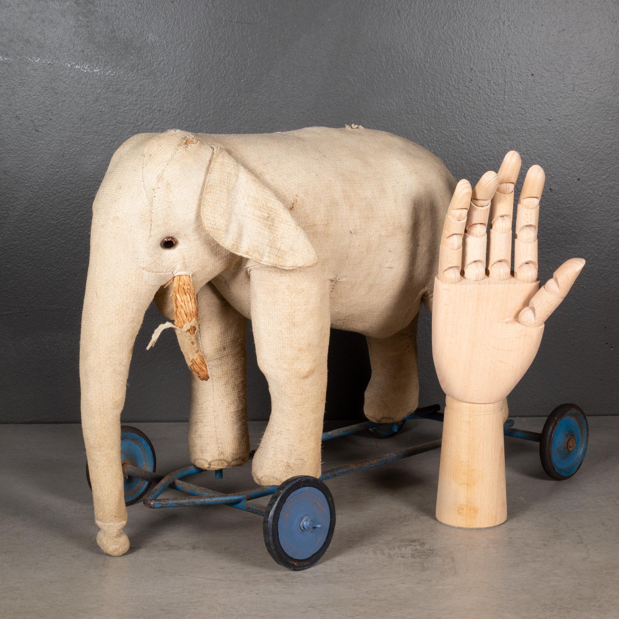 ABOUT

An early 20th century French elephant pull-toy covered in fabric with glass eyes  mounted on a steel platform with steel and rubber wheels.

    CREATOR Unknown. Made in France.
    DATE OF MANUFACTURE c.1920.
    MATERIALS AND TECHNIQUES