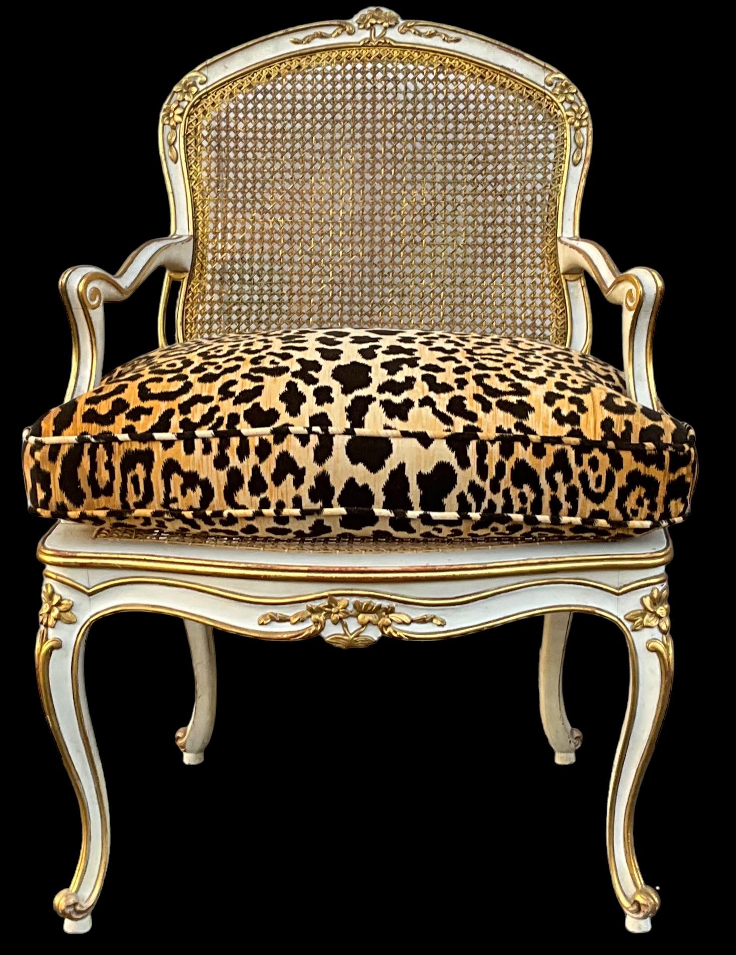 These are amazing! It is a pair of early 20th century French Louis XV style paint and water gilt caned chairs. My favorite feature is the gilt. It is wonderful. I had to re-cane the seats but the backs are original. The leopard velvet is new. There