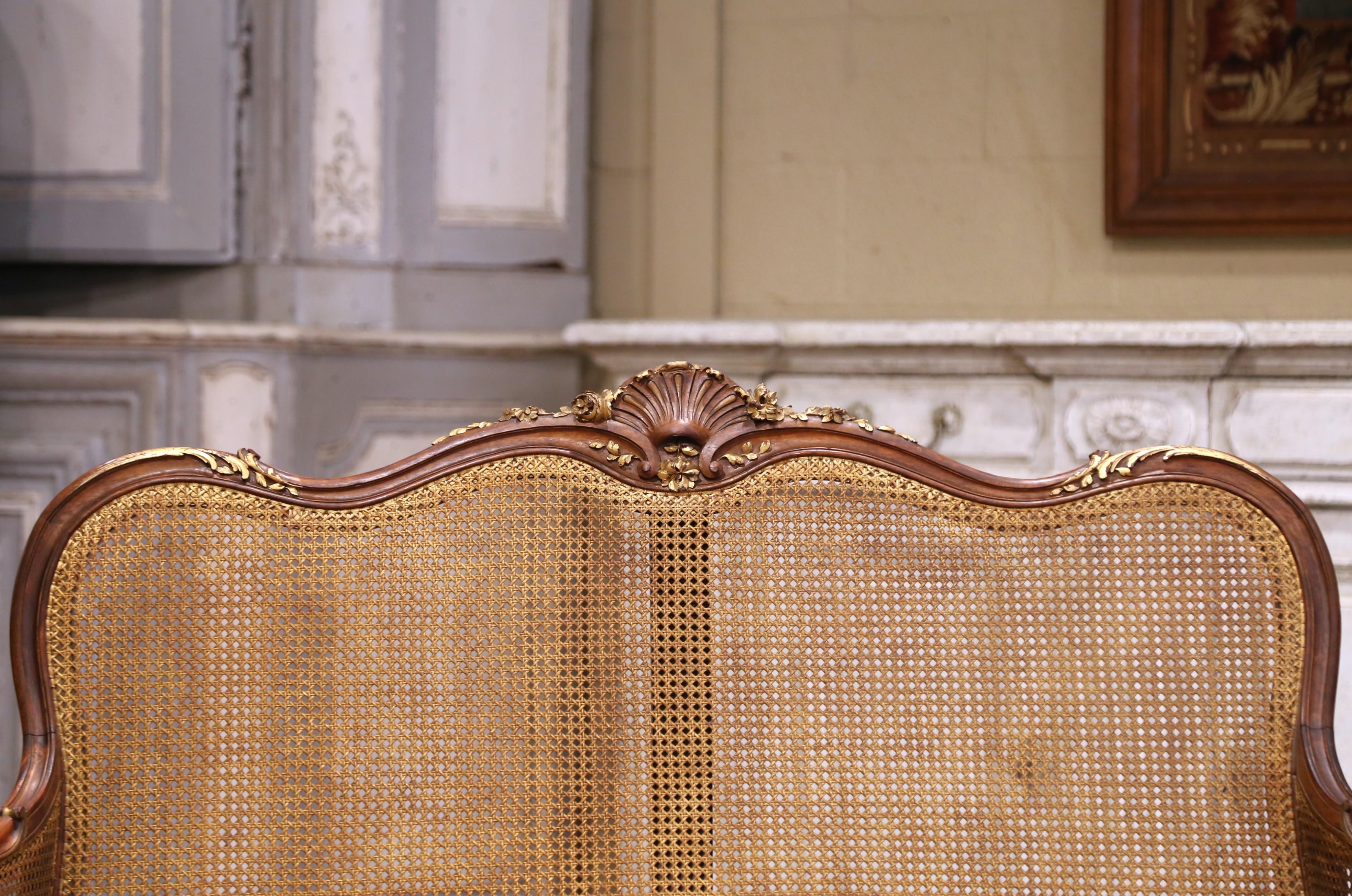 Caning Early 20th C. French Louis XV Style Walnut and Cane Settee with Parcel Gilt For Sale