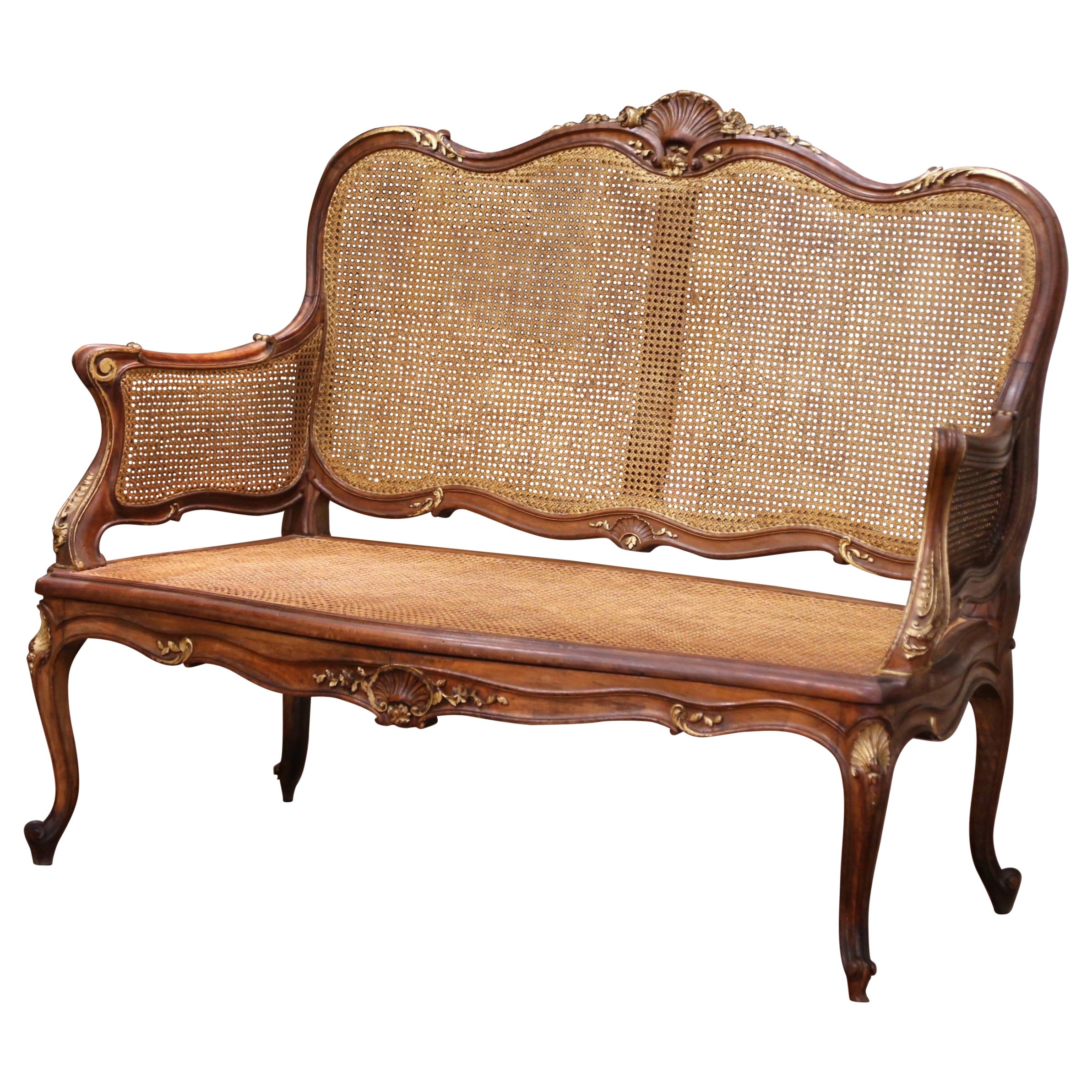 Early 20th C. French Louis XV Style Walnut and Cane Settee with Parcel Gilt For Sale