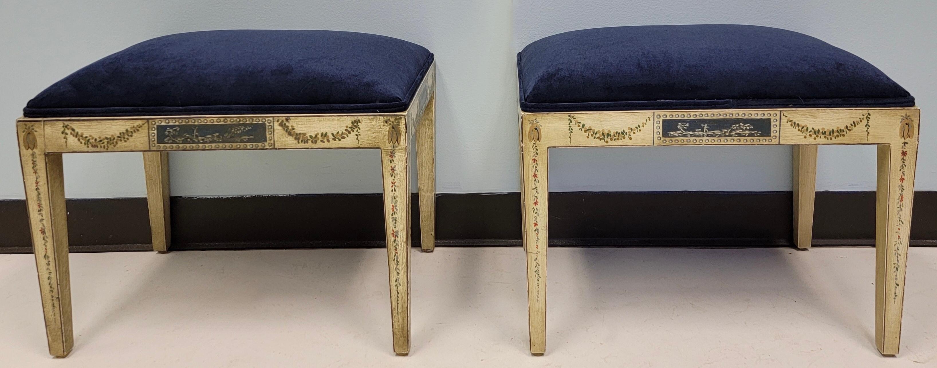 This is a pair of early 20th century pair of French neo-classical style pair of painted ottomans. They were originally petite tables, but I had them converted to ottomans with the addition of the indigo blue velvet.