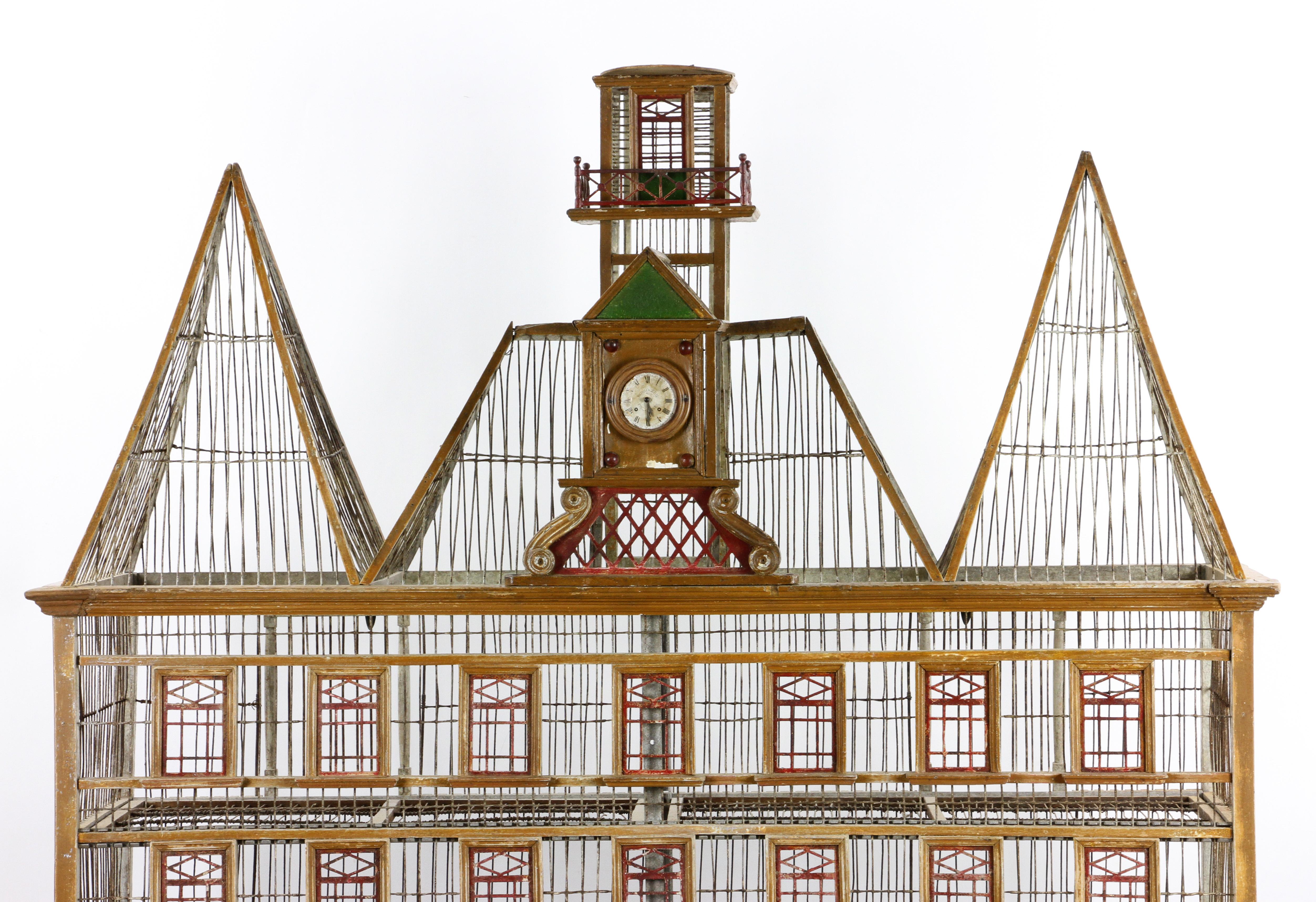 Rare early 20th century. French two-level bird house made of wood, wire, and metal, two levels, with clock face marked 