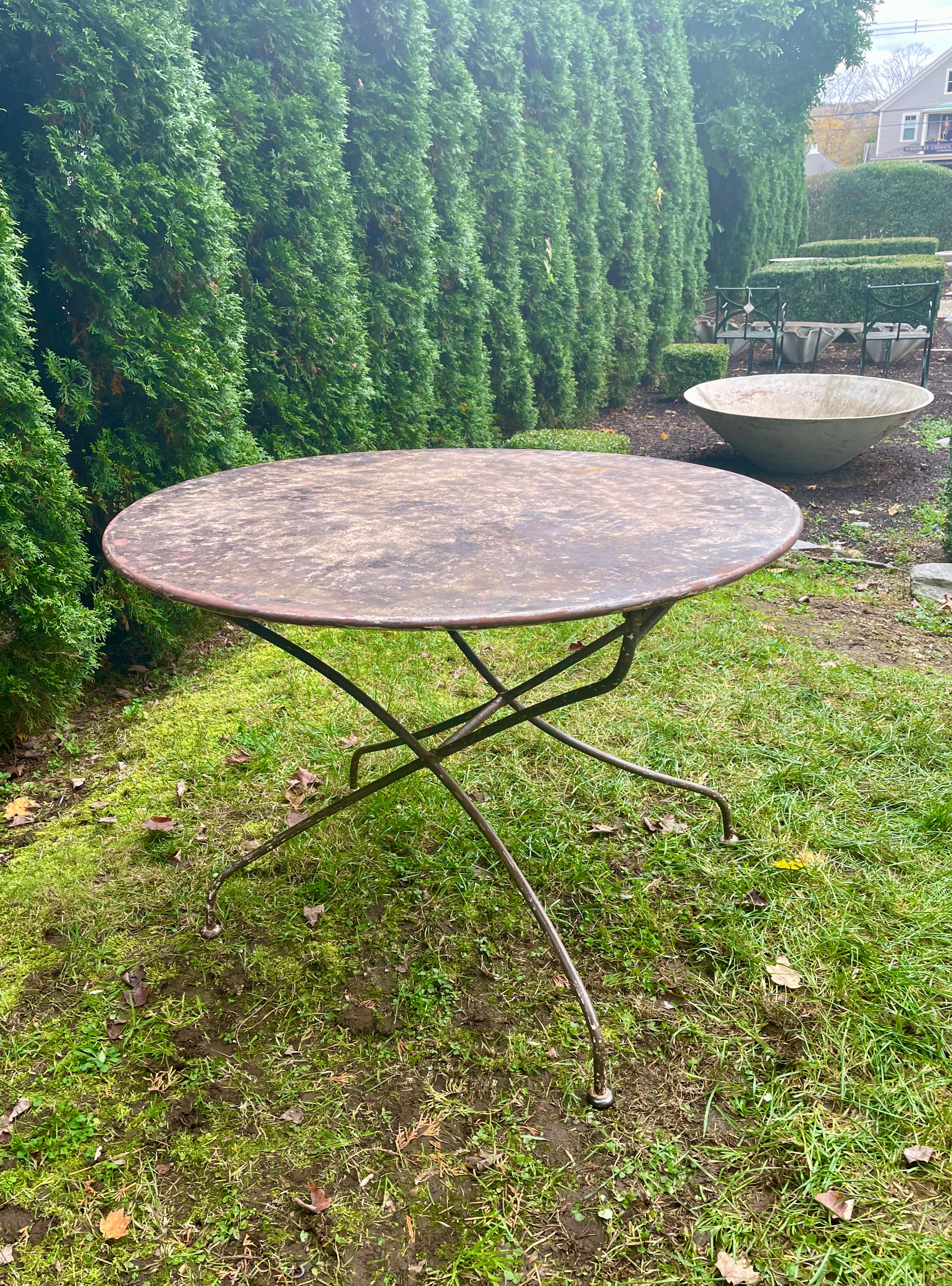 We love bistro tables, and this one is a special one with its mottled faux-painted top and folding base. Found in Provence, this beauty is in lovely antique condition and with its gently-curving legs, is a perfect addition inside or out. Weighing in