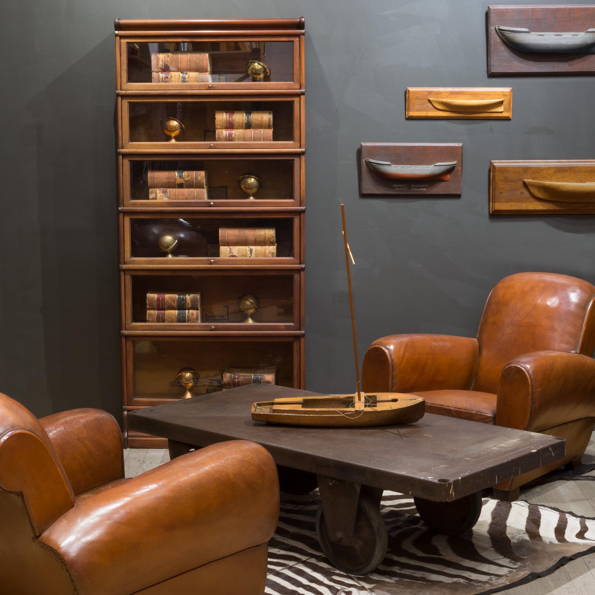 ABOUT

Contact us for more shipping options: S16 Home San Francisco. 

An original early 20th century modular 6 stack lawyer's bookcase in a Mahogany finish with a rare bottom drawer, brass knobs, brass plated metal straps and glass doors that