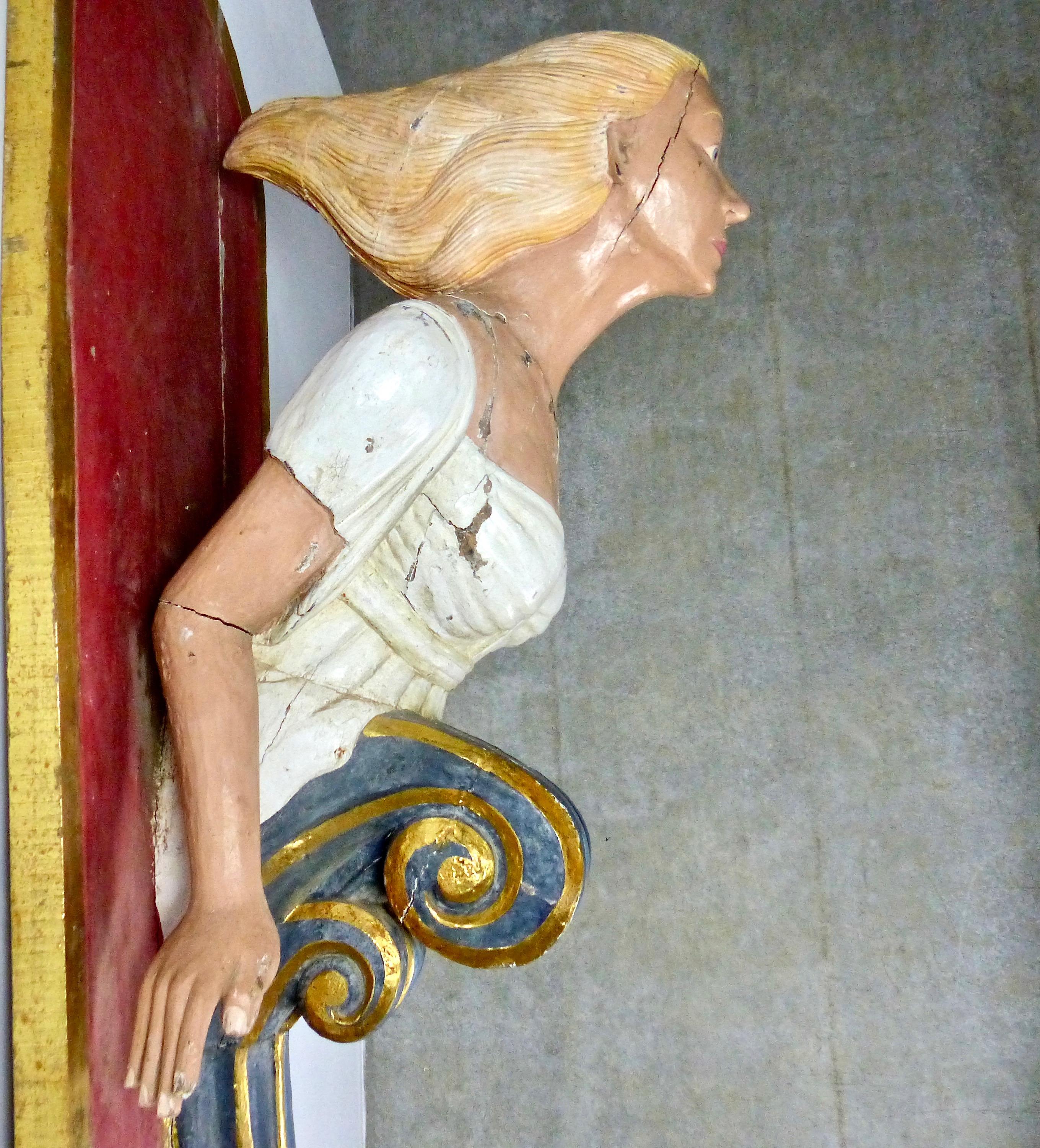 Intriguing wooden Folk Art from a carnival or circus, representing a ship figurehead/mermaid. Hand carved in the early 20th century, it has its original, age-cracked surface paint. Nice colorful details including some gilt. Acquired from a private