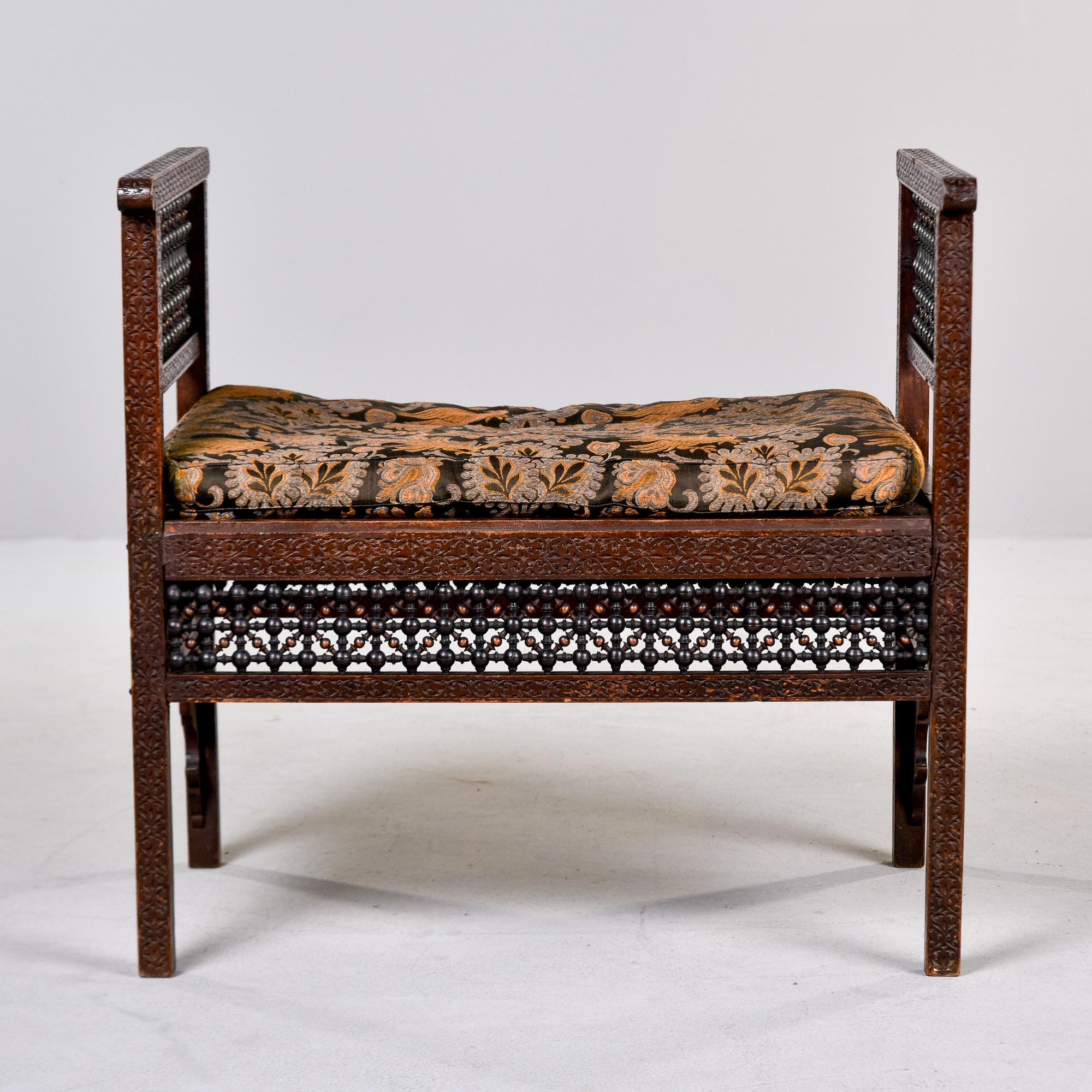 Turkish Early 20th C Heavily Carved Teak Moorish Bench With Tall Sides and Cushion For Sale
