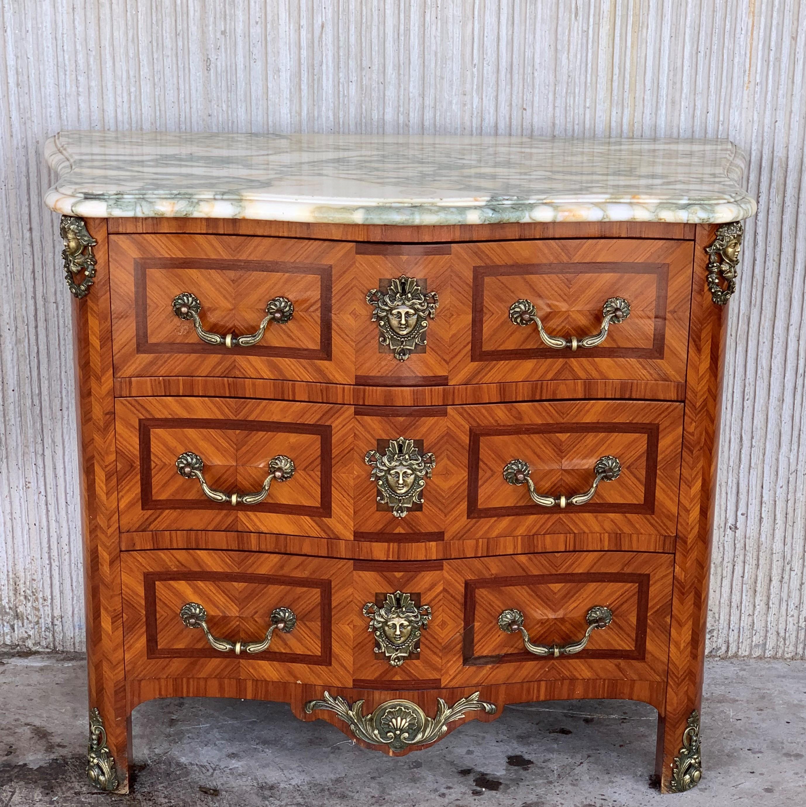 An exquisite early 20th century Italian period Baroque three-drawer chest with serpentine front and drawers and beautiful bronze mounts. The top is made of beleveled marble.
