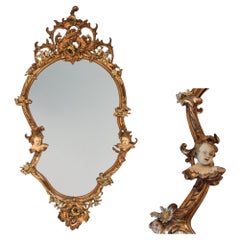 Specchio da parete in legno dorato e dipinto a gesso dei primi del Novecento italiano