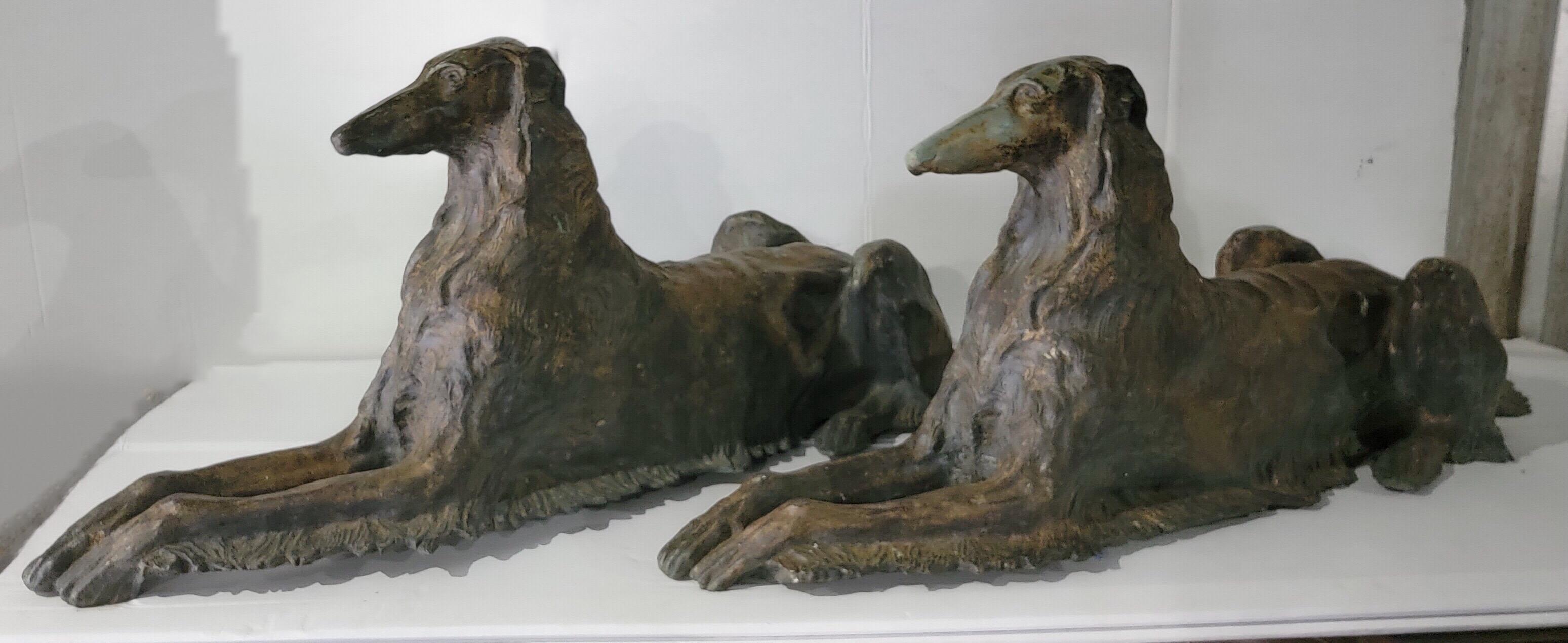 Make a statement with these! is a pair of early 20th century life-size recumbent patinated bronze Borzoi dogs in very good condition. They are a mirrored pair.