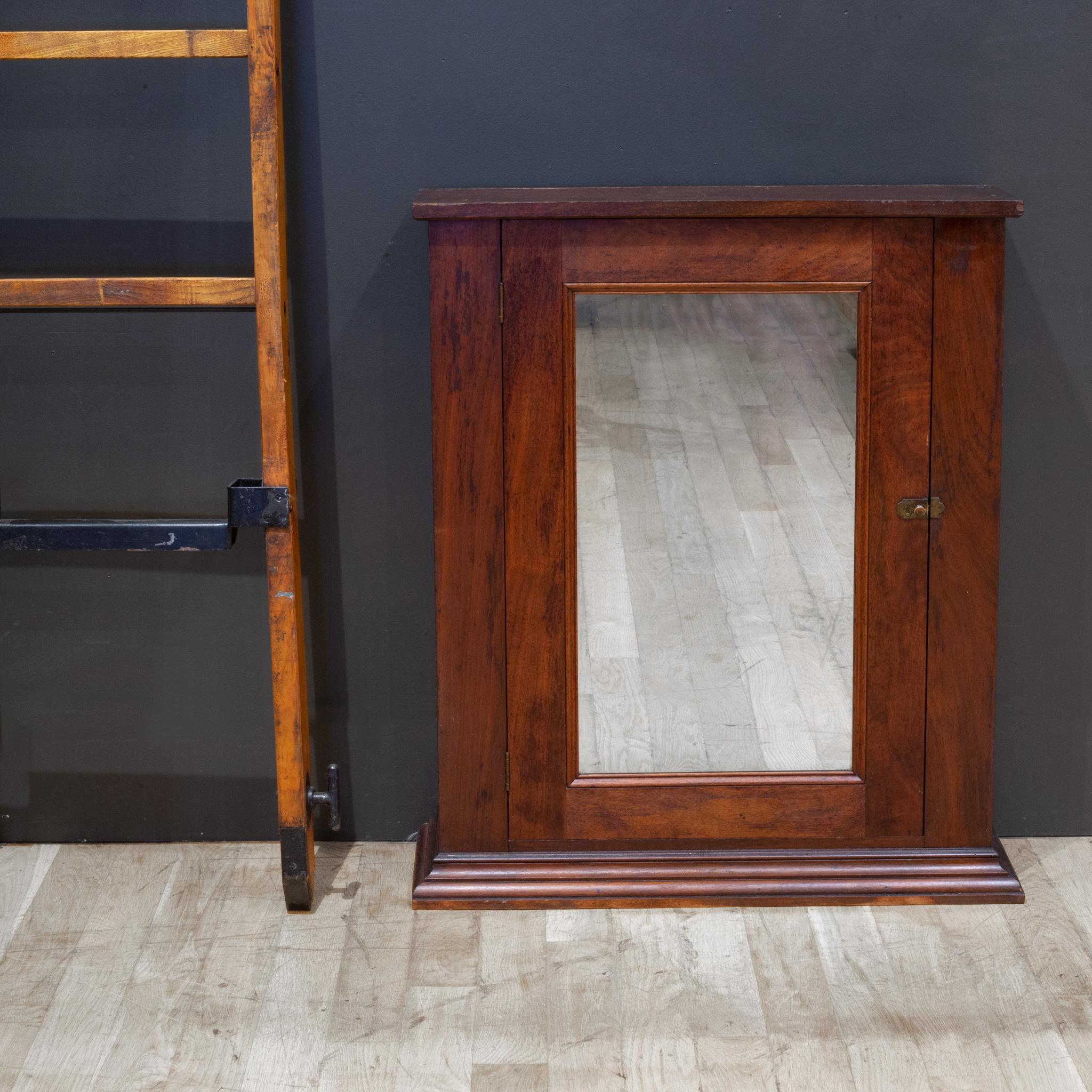 ABOUT

An antique Mahogany wall cabinet or bathroom medicine cabinet with three shelves, brass pegs and bronze lock. Solid Mahogany throughout.

    CREATOR Unknown.
    DATE OF MANUFACTURE c.1920-1940.
    MATERIALS AND TECHNIQUES Mahogany Wood,