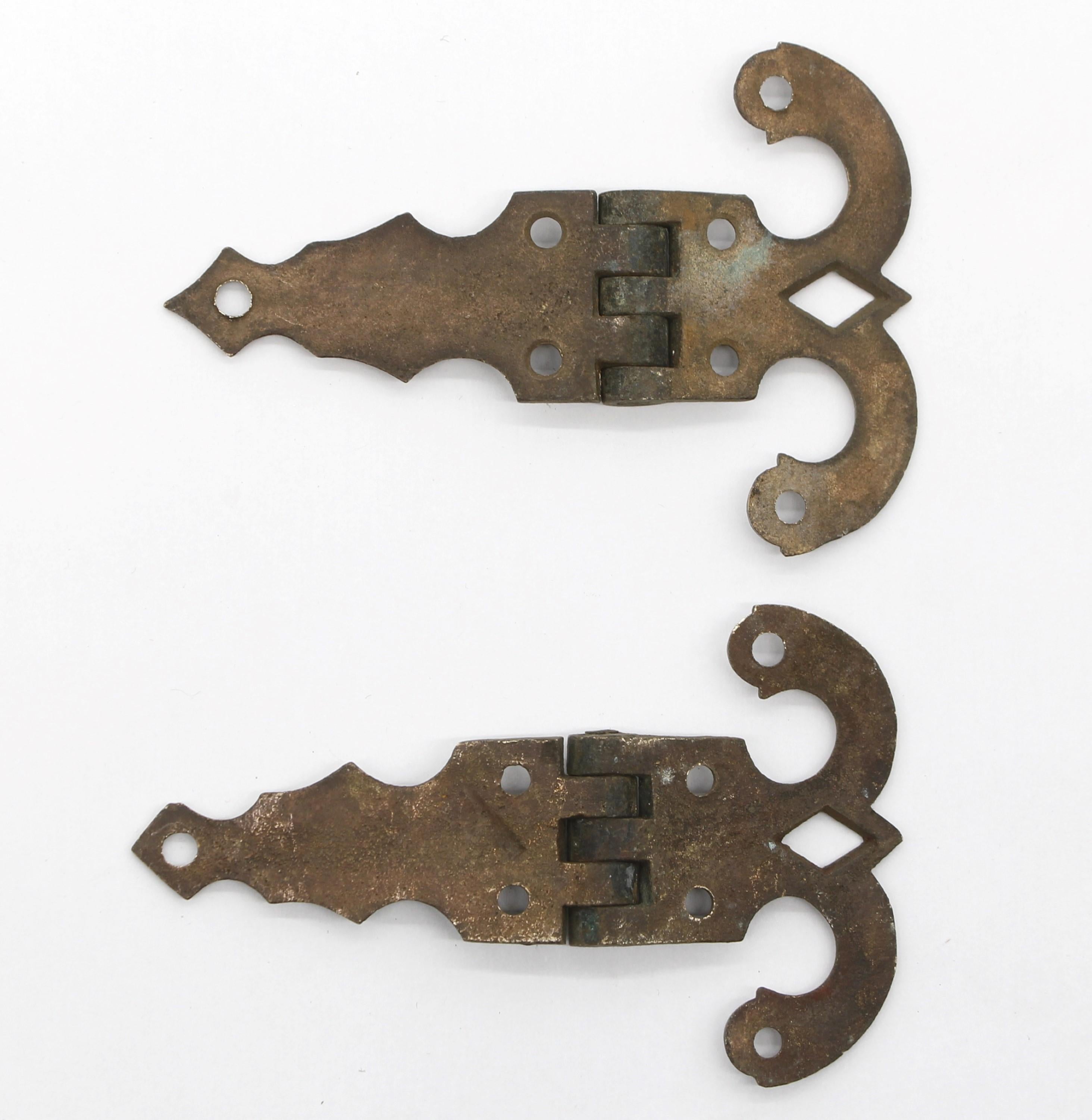 Early 20th century pair of matching solid bronze antique surface mount ice box hinges featuring five knuckles. Priced as a pair. Please note, this item is located in our Scranton, PA location.