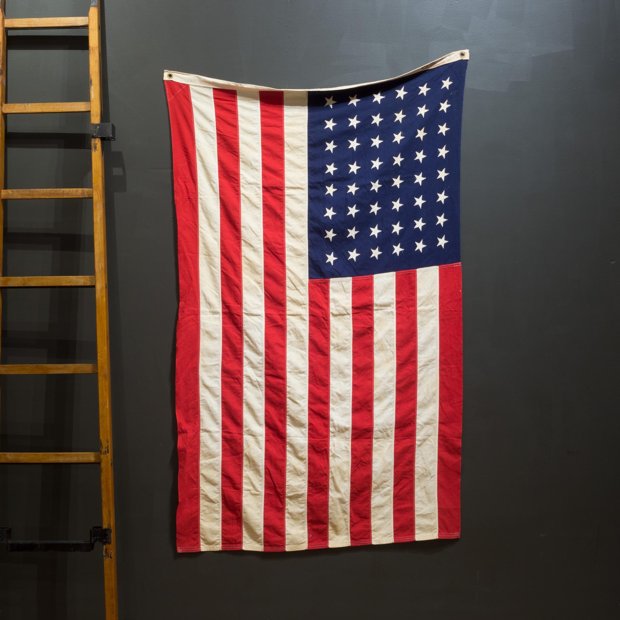 ABOUT

This is an original monumental American flag made by Bulldog Bunting Co. with 48 hand sewn stars and stripes. It is in good condition and has metal grommets to hang.

 CREATOR Bulldog Bunting Co.
 DATE OF MANUFACTURE c.1940-1950.
