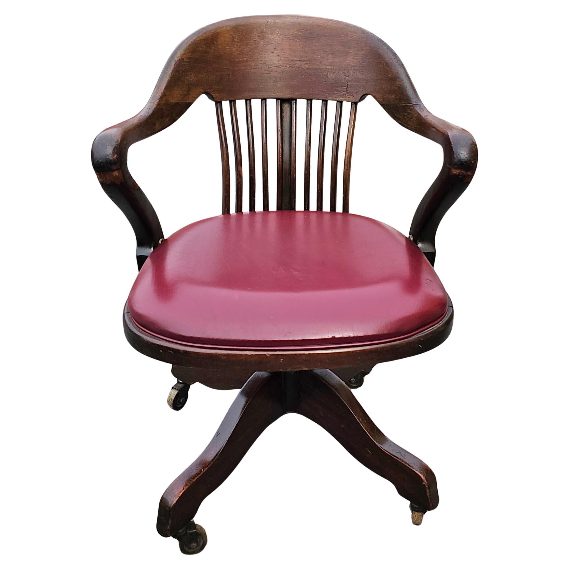 Stained Early 20th C. Oak and Vinyl Upholstered Seat Rolling & Swivelling Banker's Chair For Sale