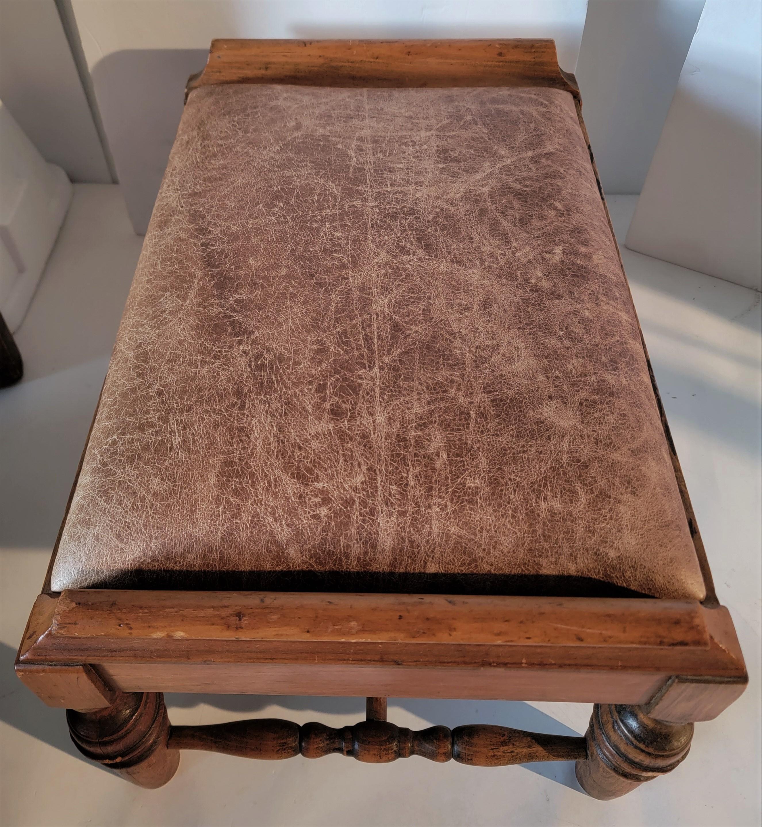 Early 20th C Ottoman Upholstered in a Distressed Leather In Good Condition For Sale In Los Angeles, CA
